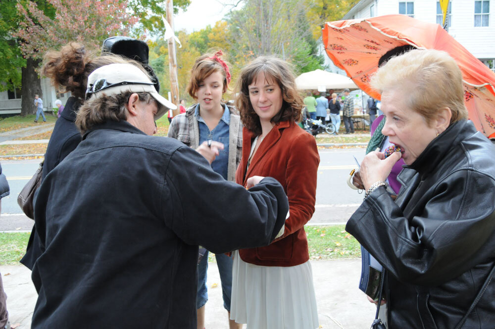 Ila hands out vegan donuts at the Ashfield Fall Festival