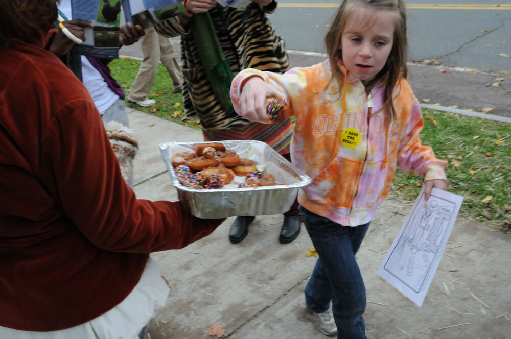 Young girl takes vegan donut at the Ashfield Fall Festival