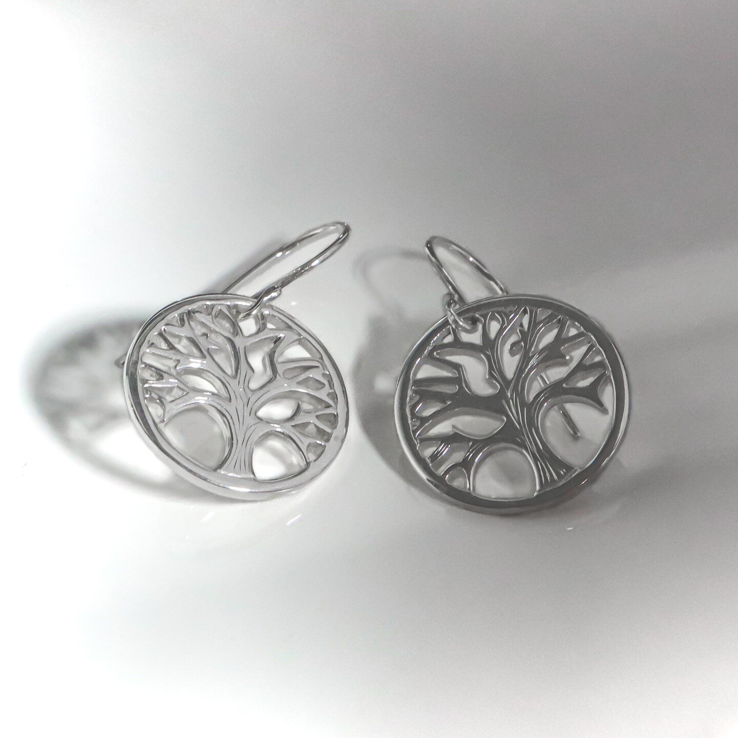 I got to bring out my very tiniest sawblades for these tree of life earrings for a work friend (I may have broken a few!) They're about the size of a penny and hung from handmade ear wires.  Everything made from recycled sterling eco-silver.
