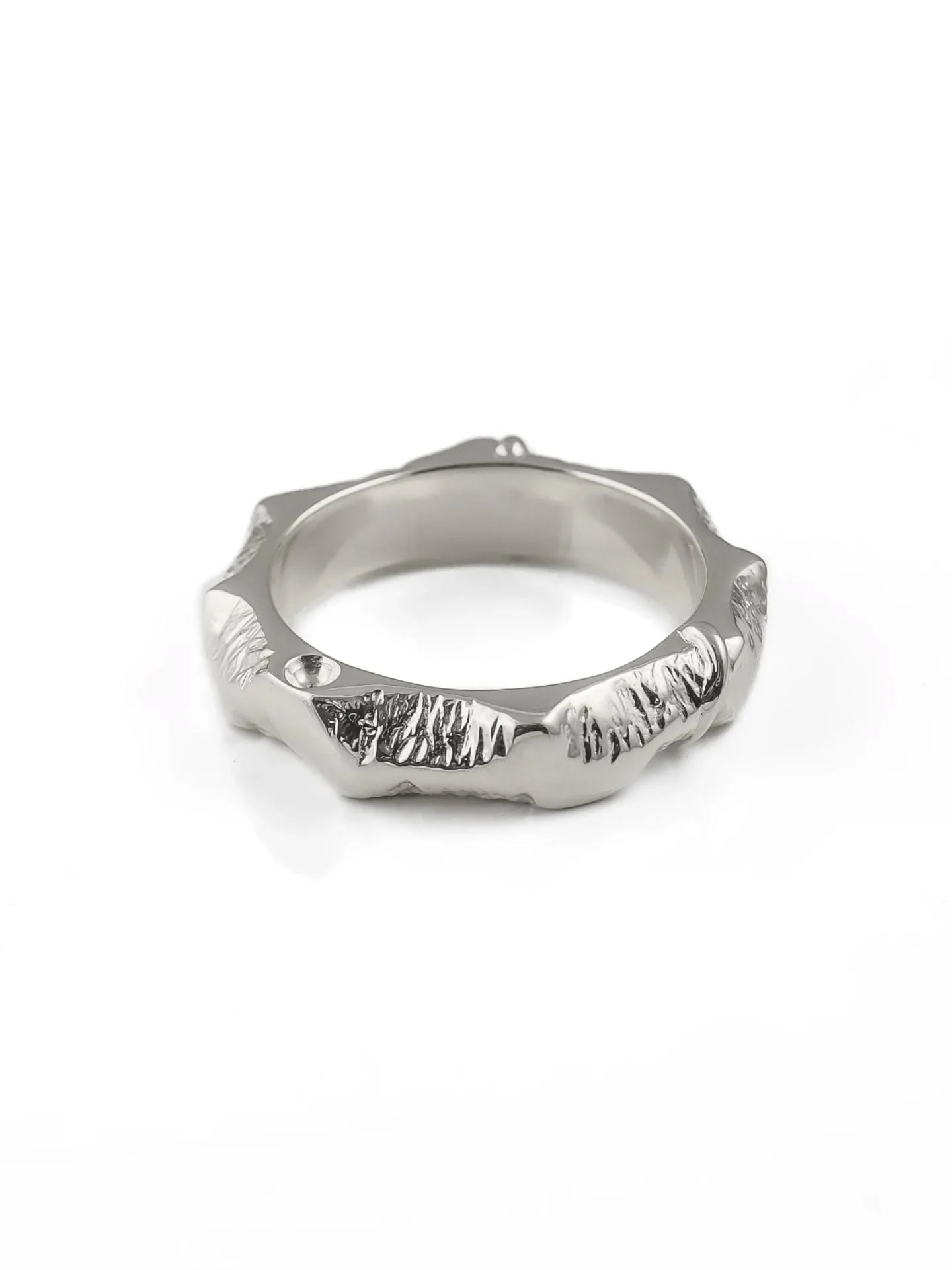 Next up, we have Mark's gorgeous textured ring, which reminds me of a mountain range.&nbsp;

The contrast of the rugged texture carved into the sides of wax with the smooth, polished top works so well. Mark also added a tiny circular indentation as h