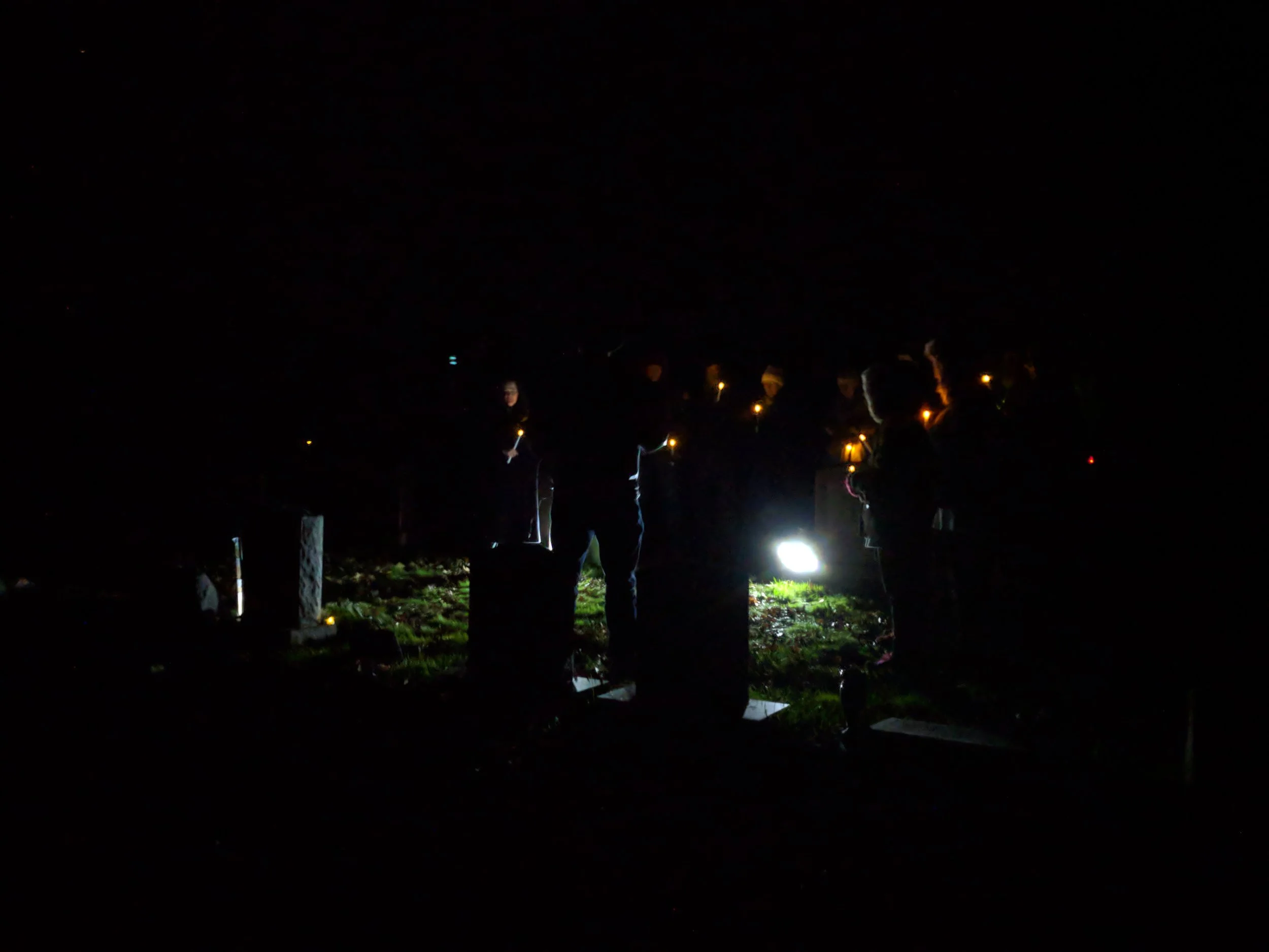 A vigil at the grave of two of the Allenstown victims. Their remains are now in the custody of the New Hampshire State Police.