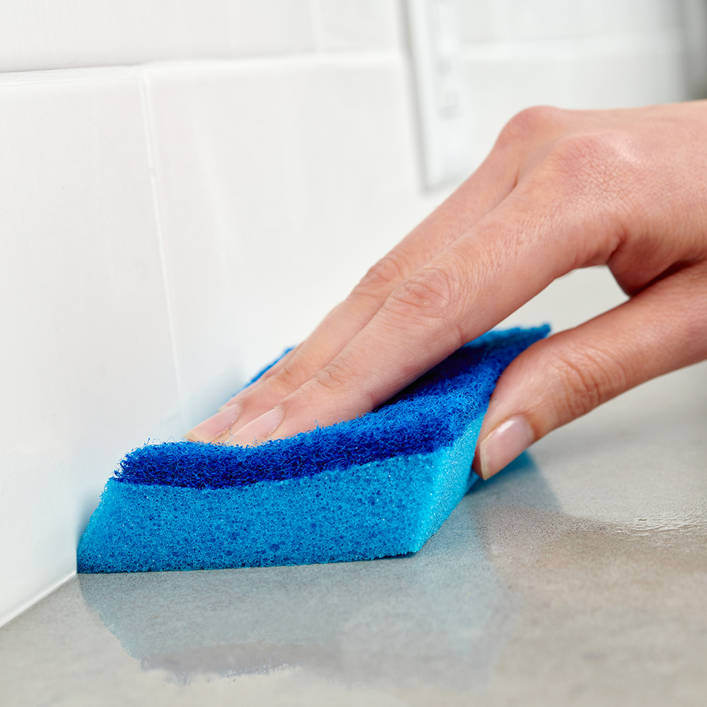 Brillo® Estracell® No Scratch Scrub Sponge with Wedge Edge cleaning a counter