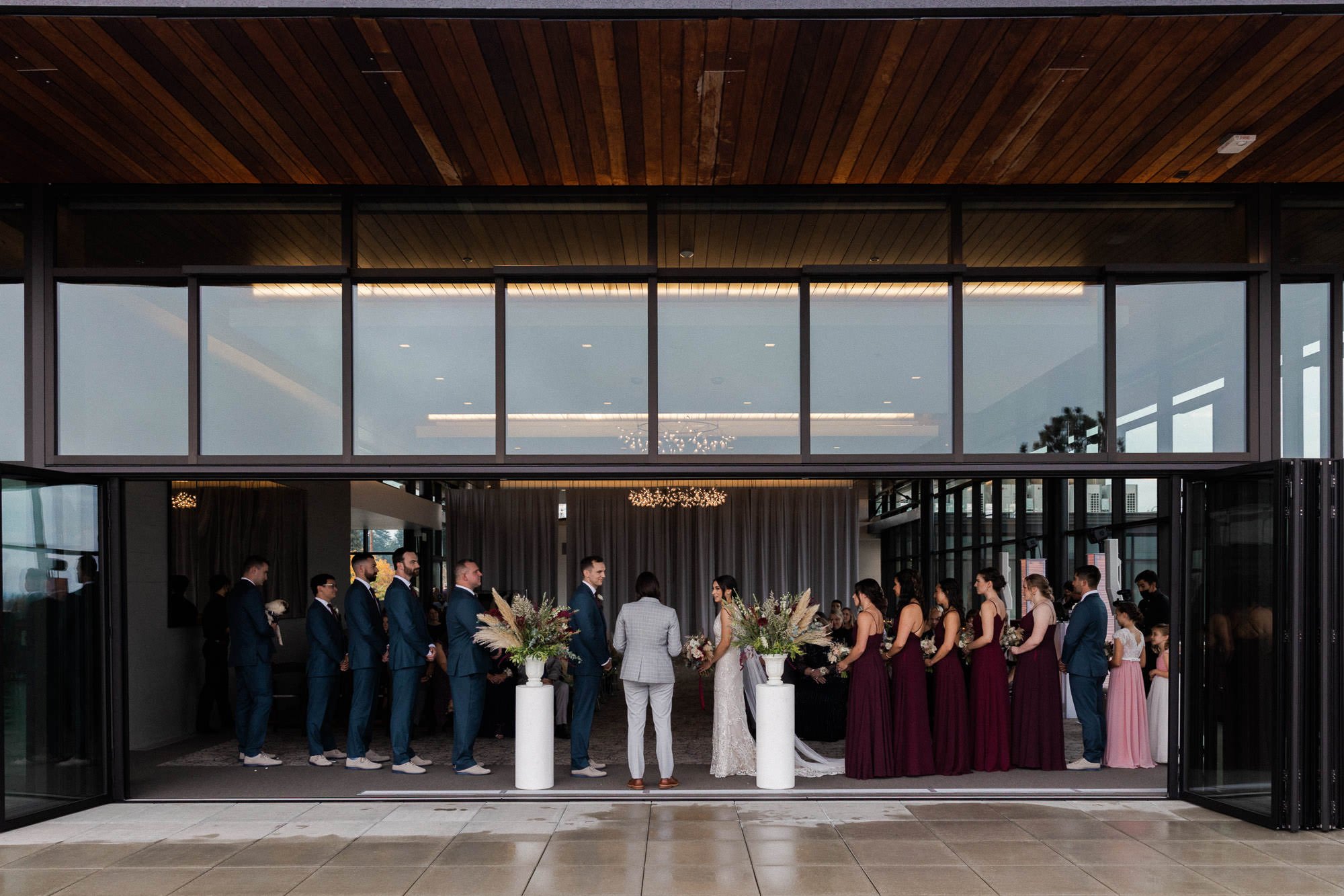 view of wedding ceremony from balcony at ironlight wedding venue in lake oswego, oregon