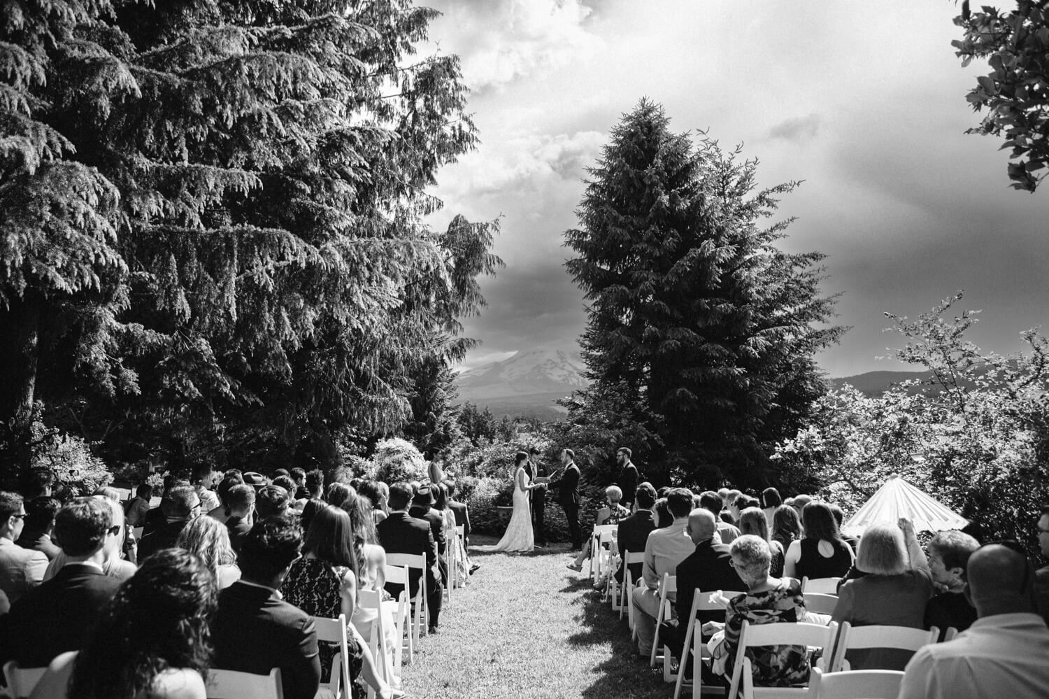062_Mount Hood Organic Farms Wedding-Black and white photo of wedding ceremony in front of mount hood.jpg