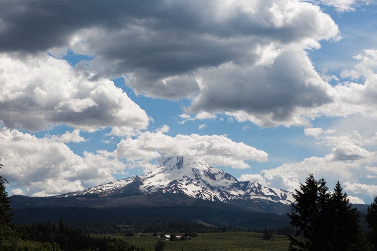 092_Mount Hood Organic Farms Wedding-Mount hood surrounded by white clouds.jpg