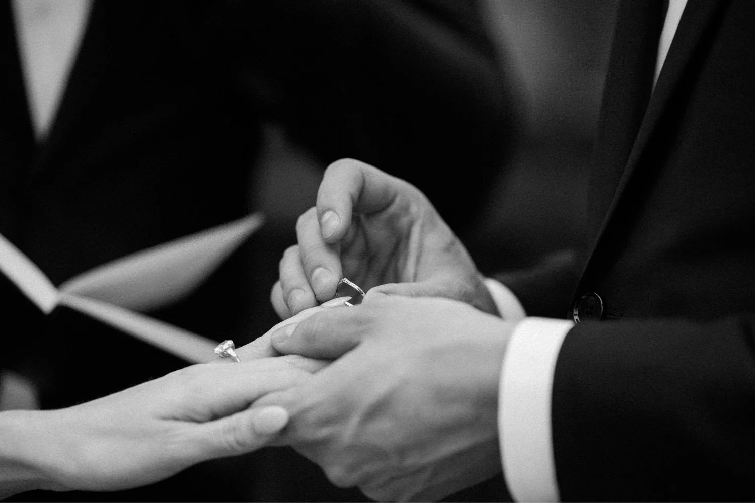 080_Blockhouse PDX Portland wedding 16_Hands of groom placing wedding band on bride’s finger.jpg