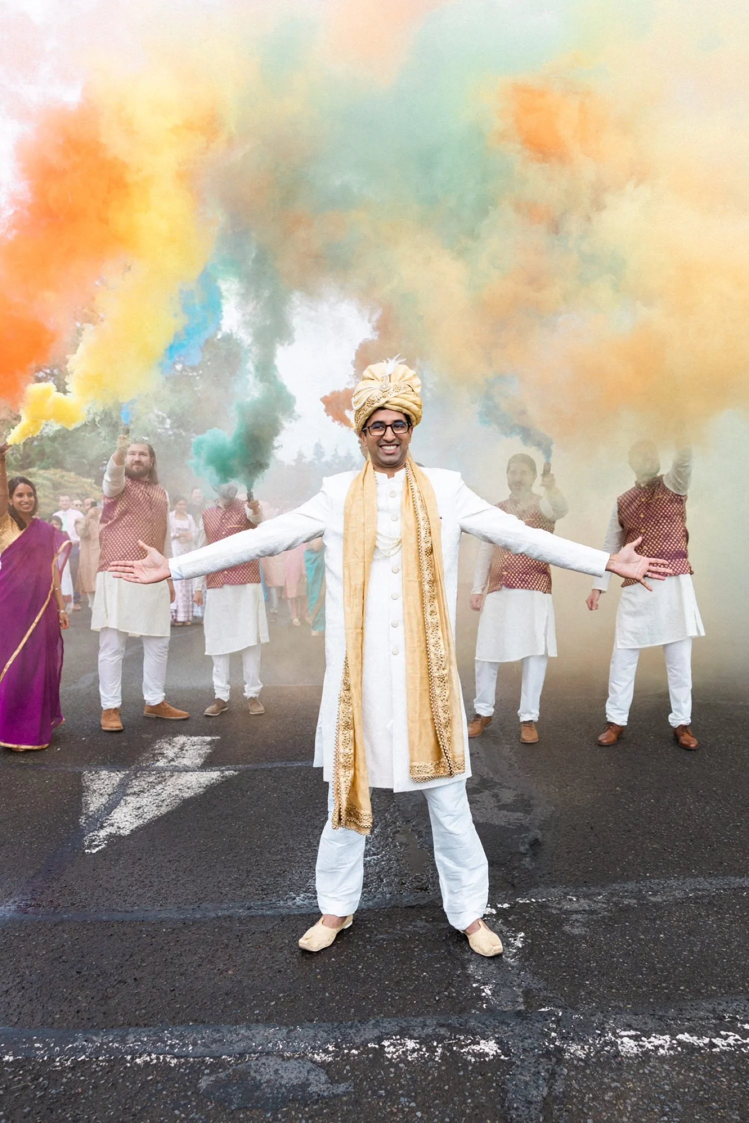 025_Oregon Golf Club Indian Wedding-86_groom stands in front of colorful smoke bombs during baraat.jpg