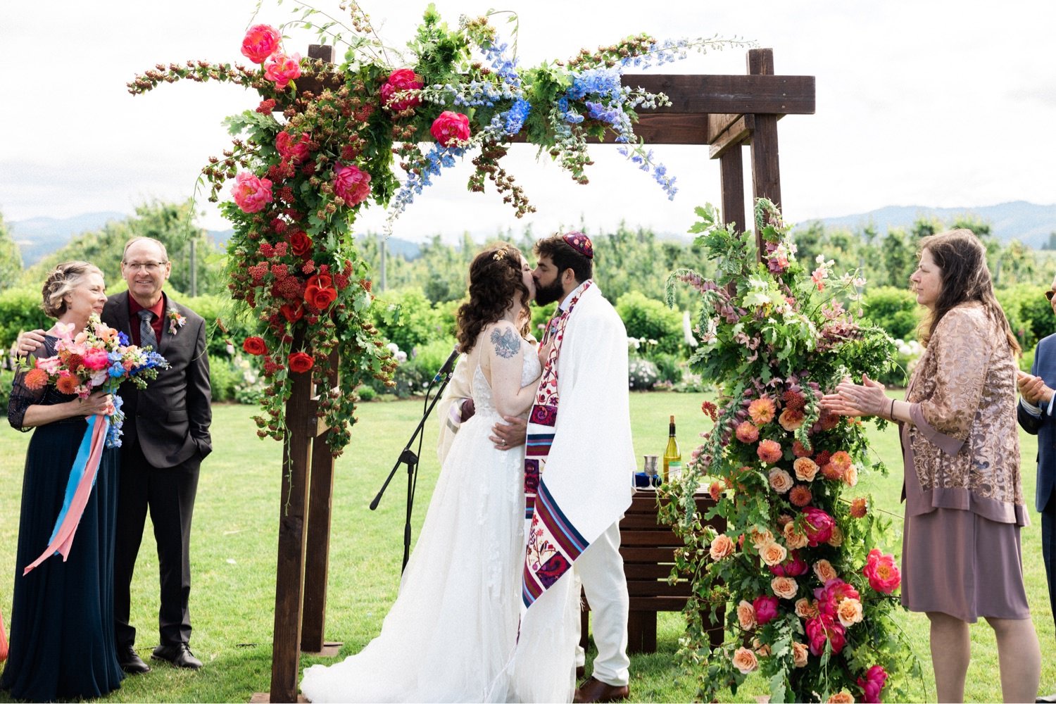 056_The Orchard Hood River Wedding98_bride and groom kiss durign jewish wedding ceremony.jpg