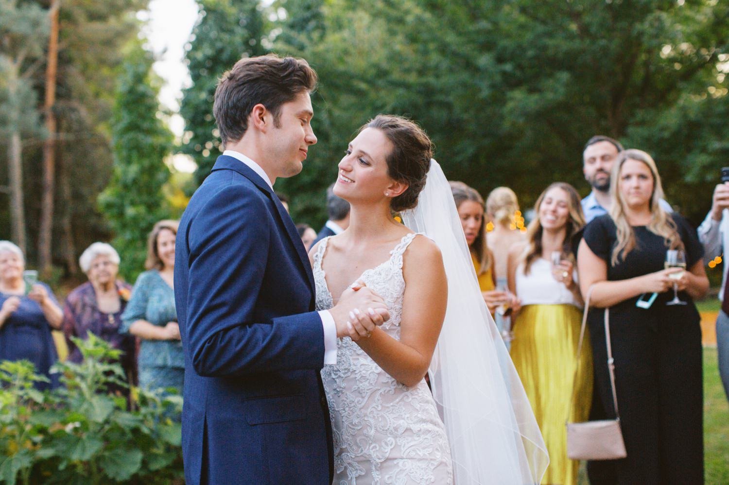  bride and groom dance in front of crowd at mcmenamins grand lodge 