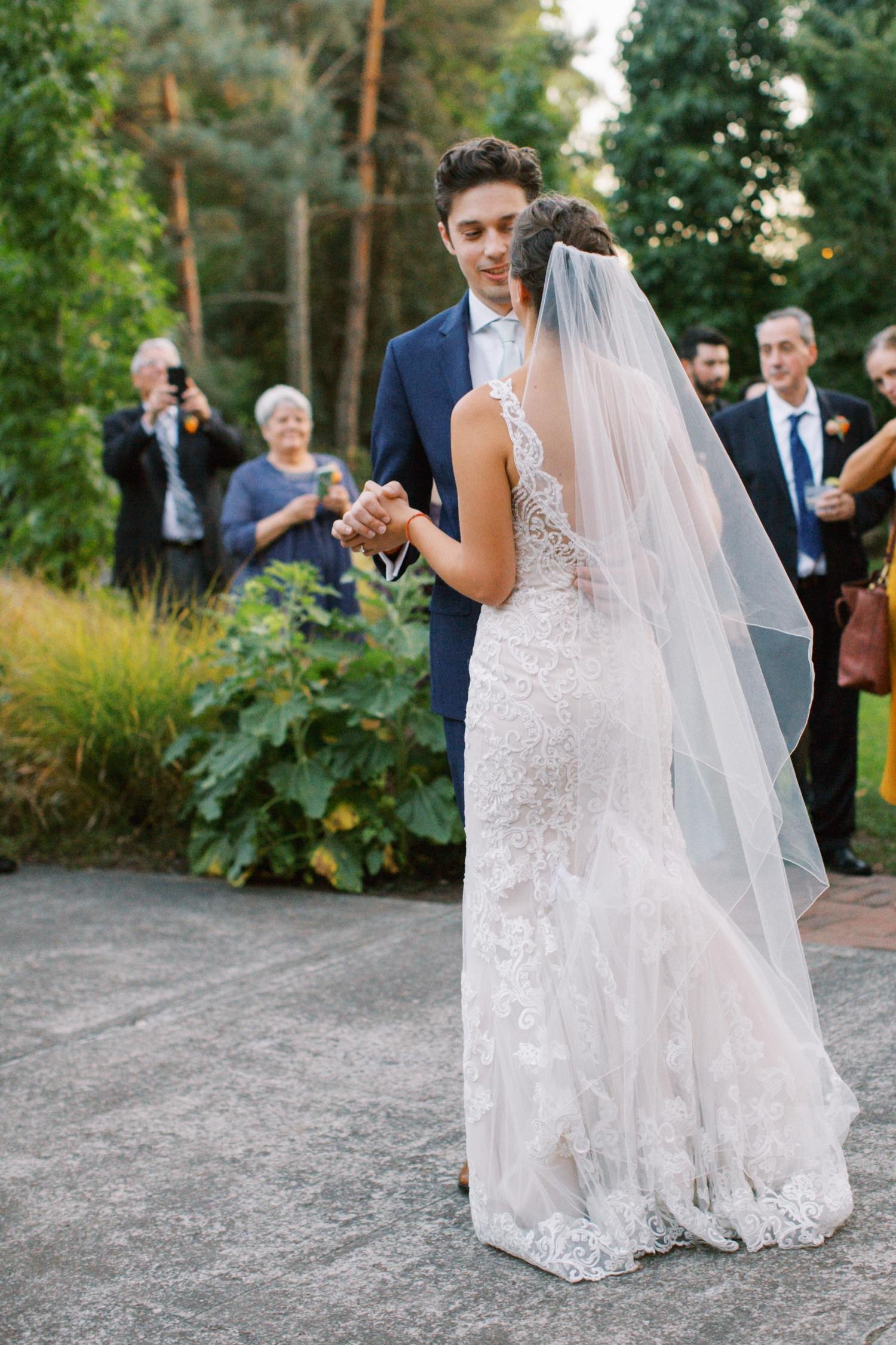  bride and groom dance in front of crowd at mcmenamins grand lodge 