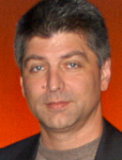 SPIKE MANTON, Development Director