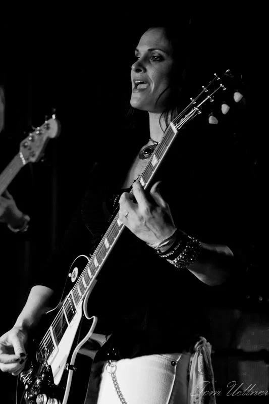 Lisa Addario Lisa plays the part of Joe Perry, who is known for his down and dirty raw guitar style and signature tones. She brings the songs to life with an authentic tone and delivers the goods. From the ever-so- recognized Talk Box in “Sweet Emotion”, the killer slide work in “Draw the Line”, to the foot stomping live performance of four decades of hit songs, Lisa delivers with passion. Photo Tom Eullener