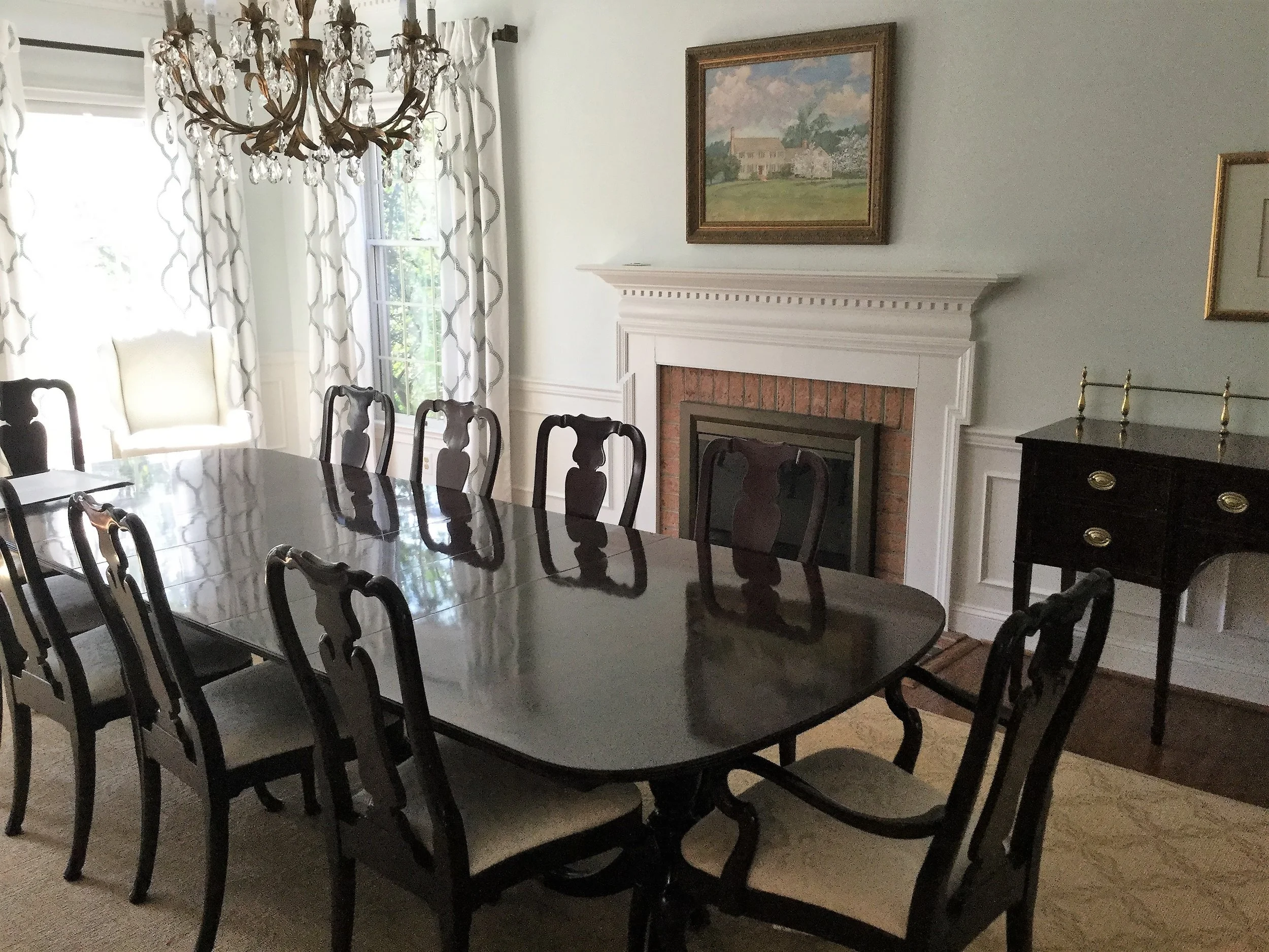 Snowdrop by Sherwin Williams is the prettiest shade of pale blue and a lovely balance to the mahogany dining room furniture. Chartreuse found in the painting and the fabric in two Queen Anne chairs (far corner)create a fresh new room.