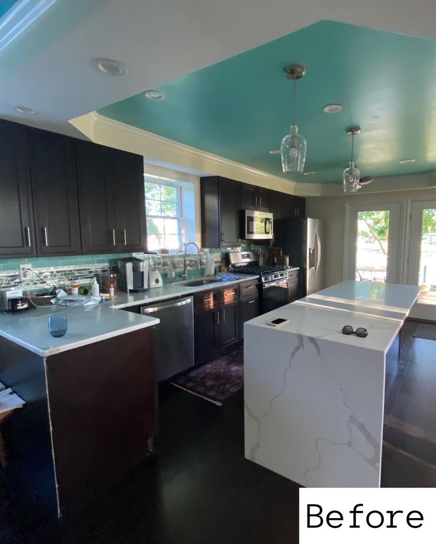 This makeover might look like it cost a fortune, but no. By simply moving the existing island to create a longer peninsula, we completely opened up the kitchen. Now those seated  have a view of the shoreline instead of the kitchen sink. We removed th