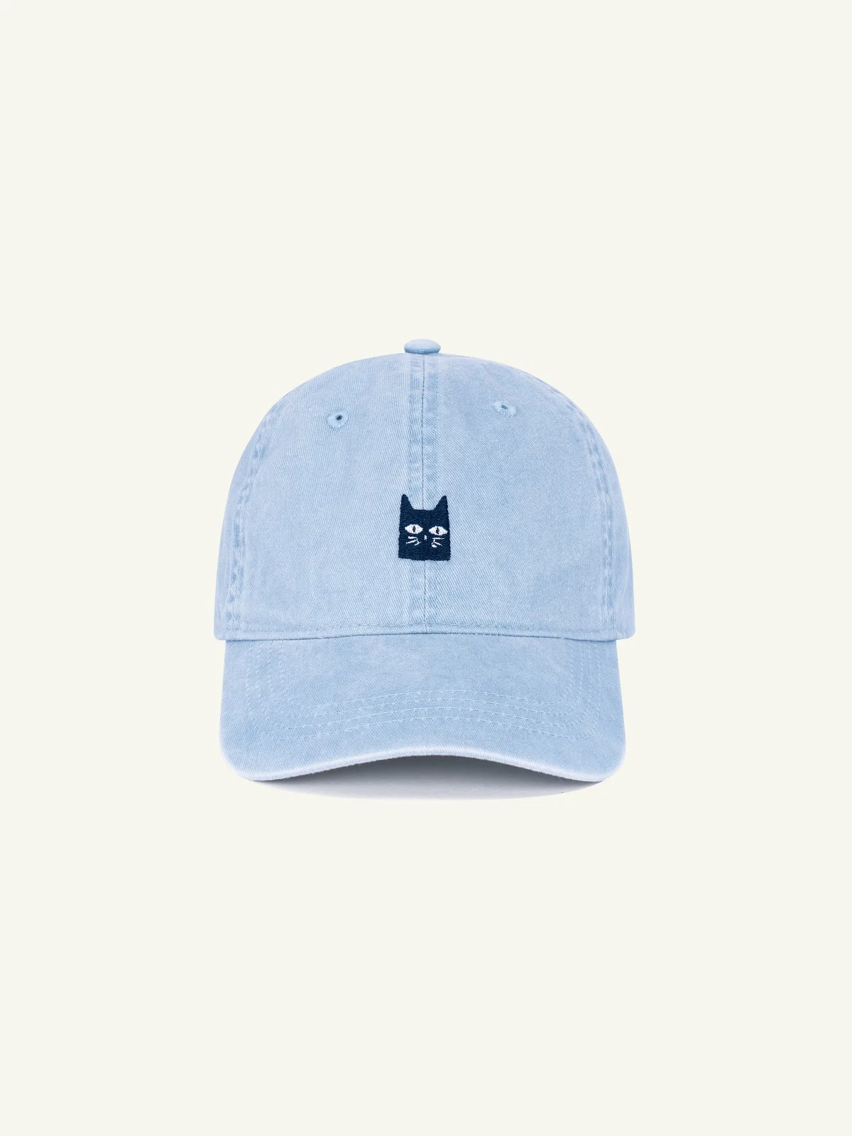 Light blue baseball cap with a small black embroidered cat face on the front.