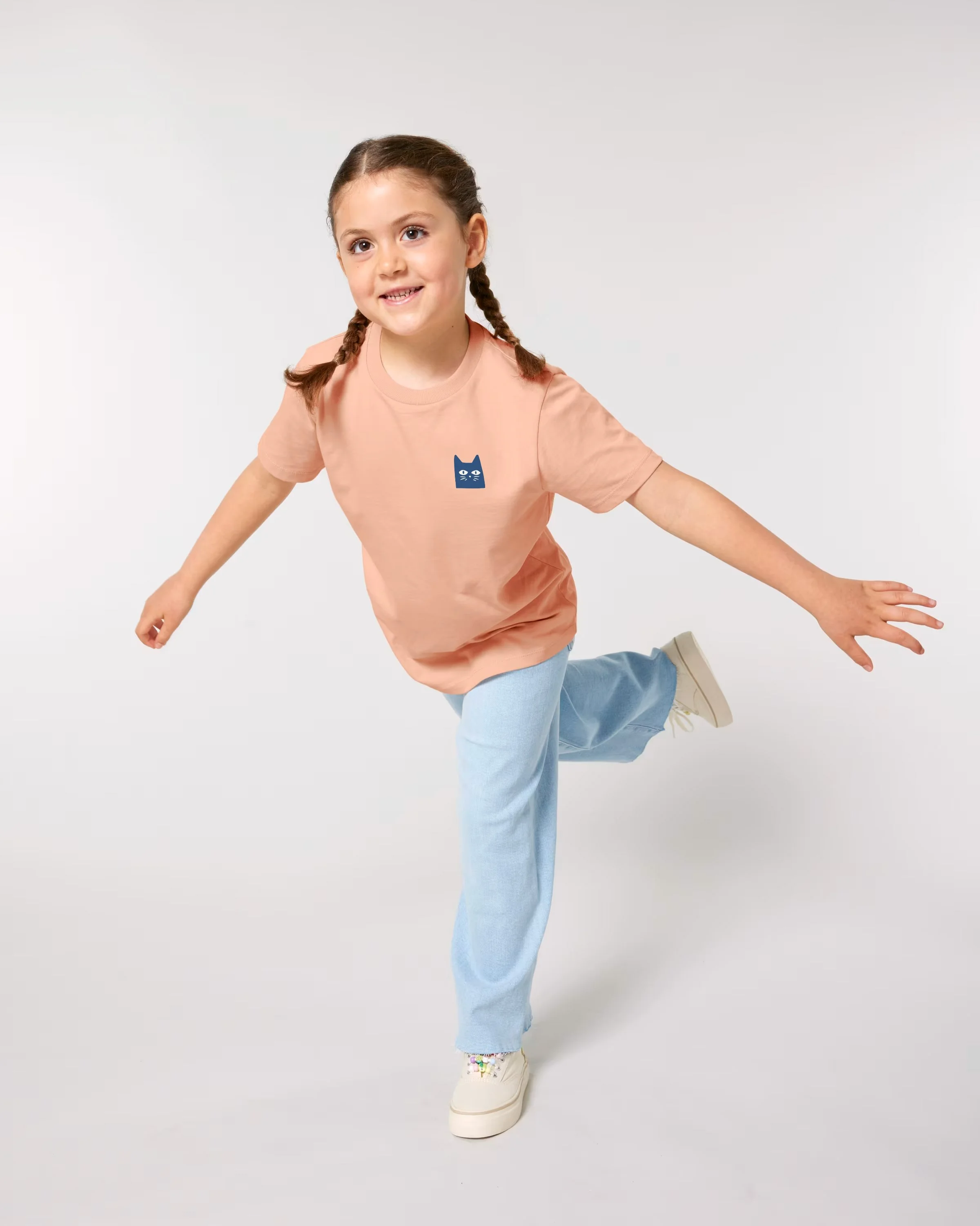 Girl wearing Contrast t shirts kids in peach, organic cotton kids style, part of sustainable kids clothing and ethical kids clothes