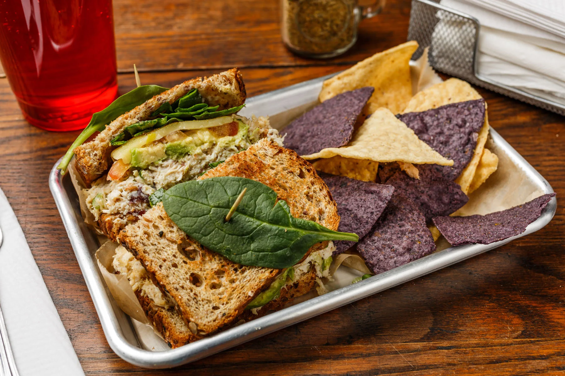 Tornado Chicken salad, cranberries, avocado, tomato, green onions, Monterey Jack cheese, spinach, and spike seasoning. Made as a wrap, sandwich, or salad. Served with organic tortilla chips. $8.99