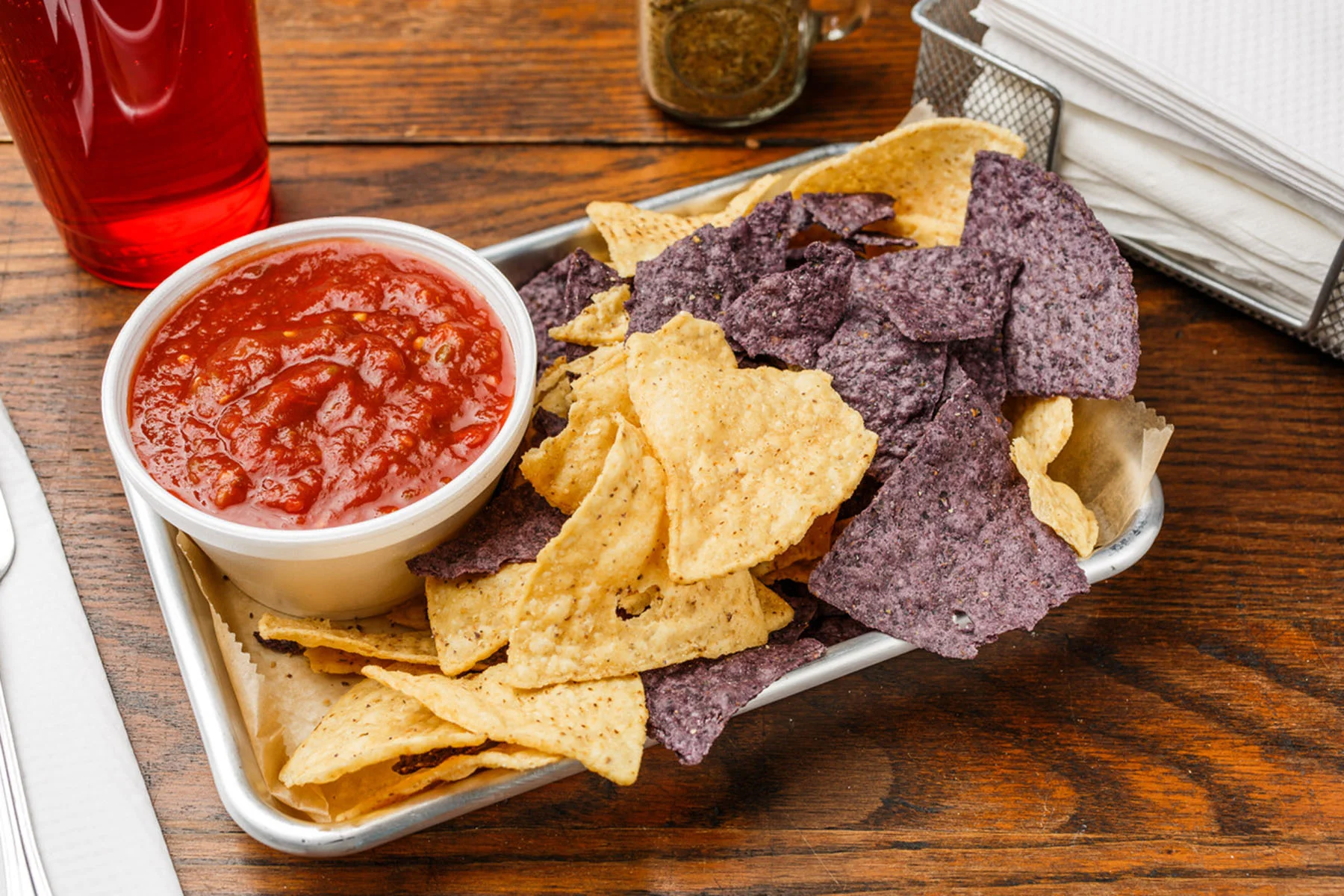 Chips & Salsa (8 oz.) Salsa served with blue and white organic tortilla chips. $6.49