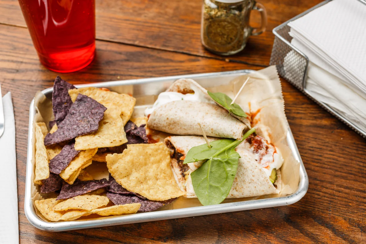 Black Bean Burrito Organic whole wheat tortilla, black beans, sour cream, avocado, and salsa. Served with organic tortilla chips. $6.49