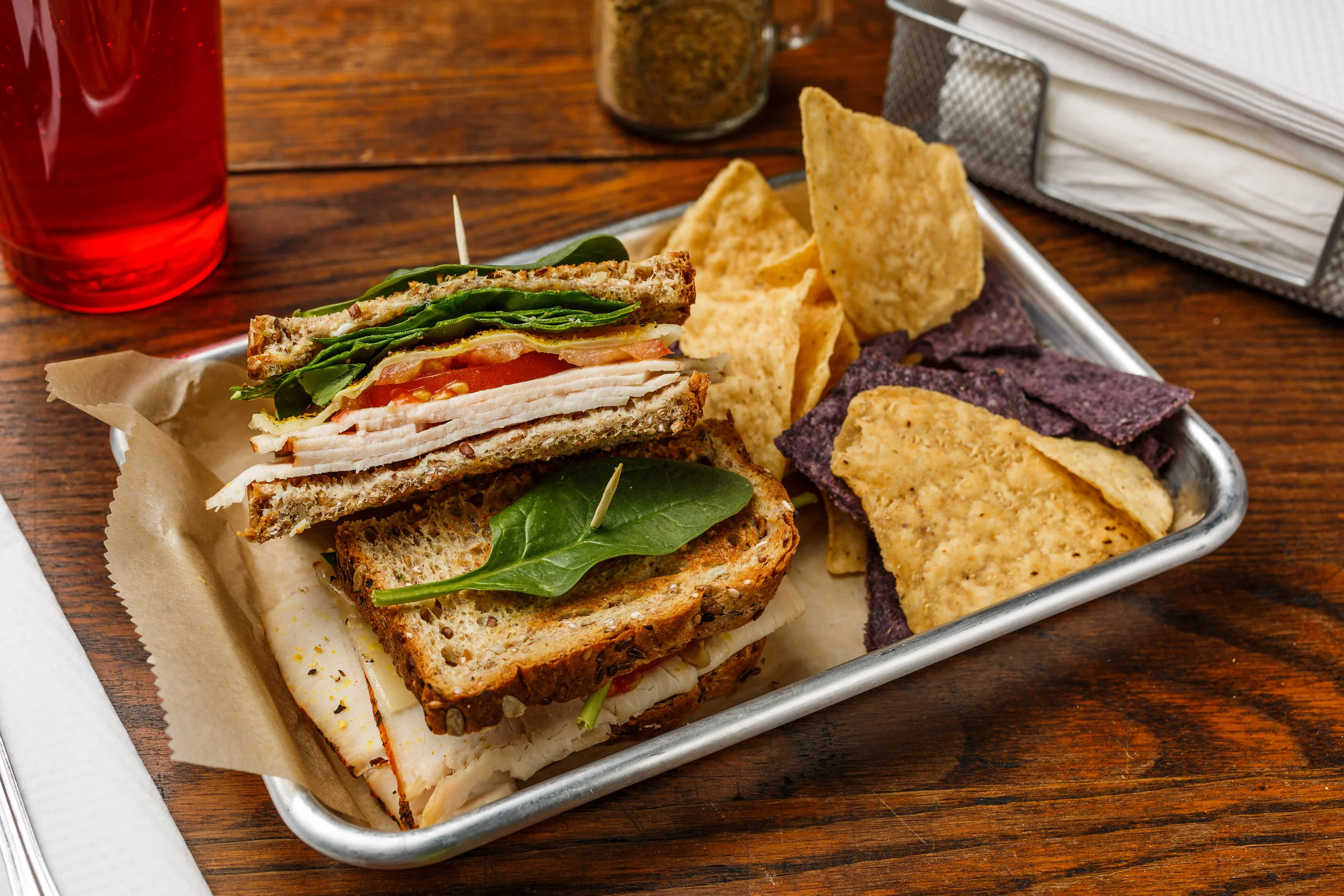 Tank Boar's head turkey, sauerkraut, tomato, green onions, Swiss cheese, spinach, mayo, and spike seasoning. Made as a wrap, sandwich, or salad. Served with organic tortilla chips. $7.59