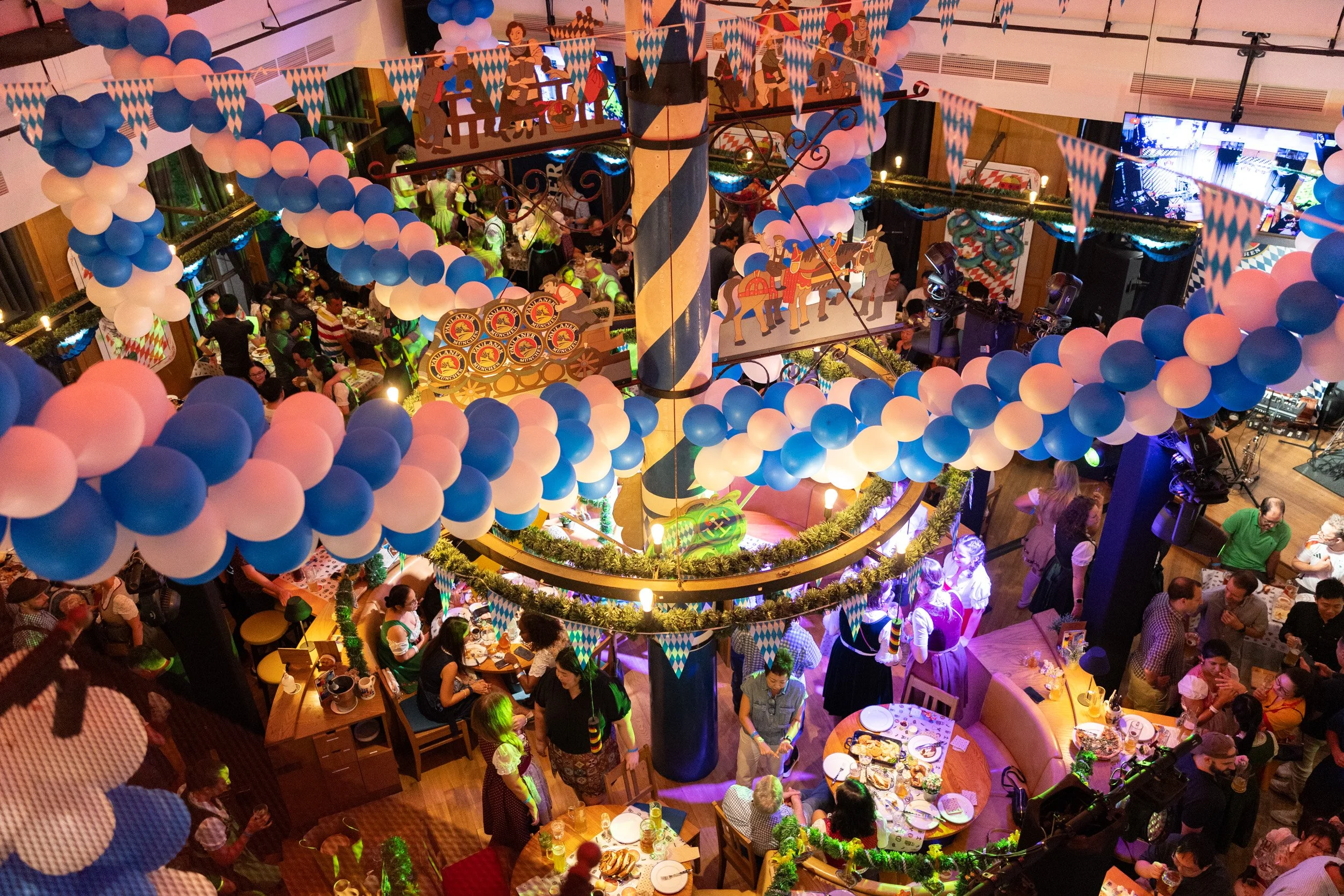  High-angle wide view of Oktoberfest venue decorations with blue and white balloons at Millenia Walk Singapore 