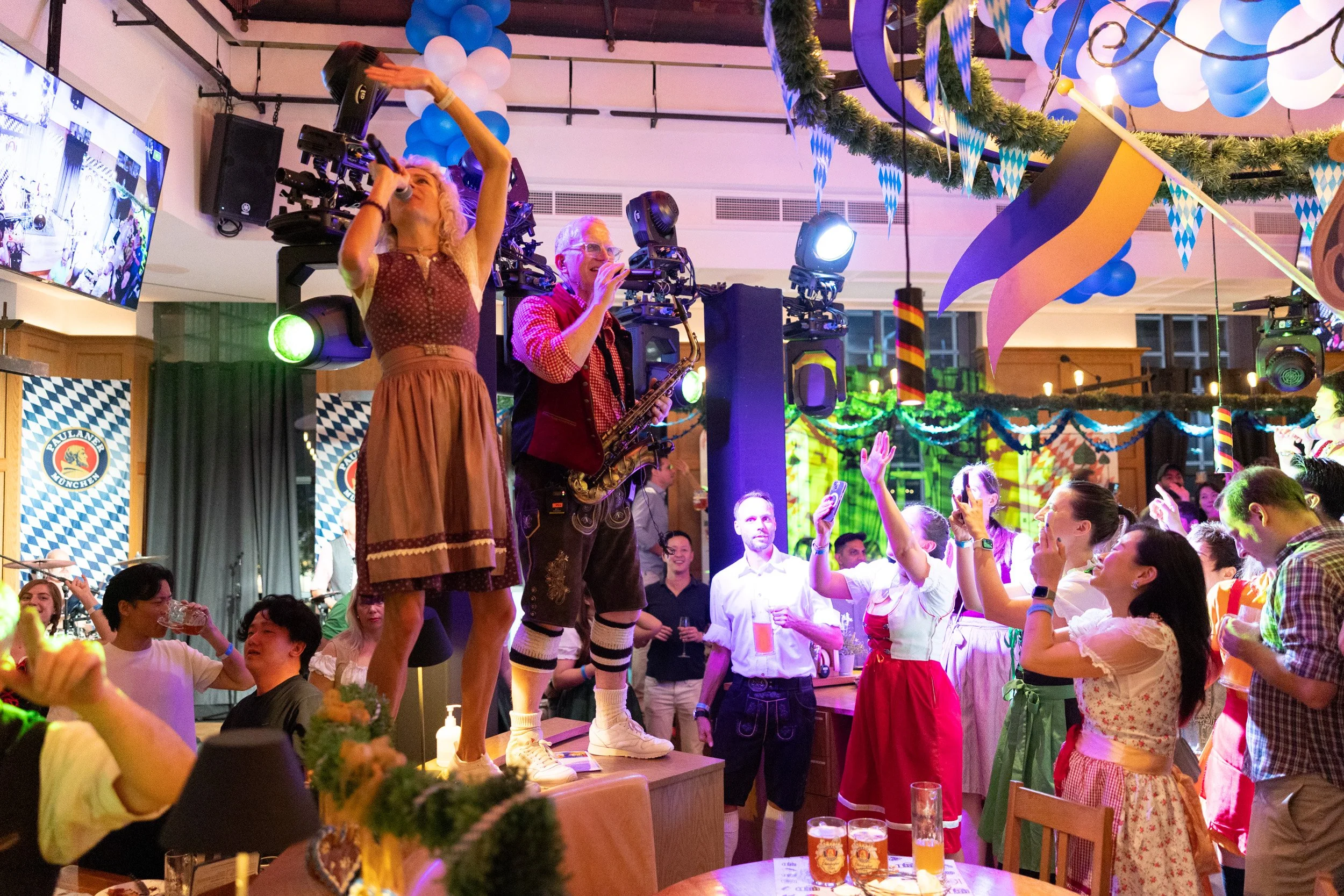  Stage performance by band members Joe and Seine Schürzenjäger at Paulaner Bräuhaus 