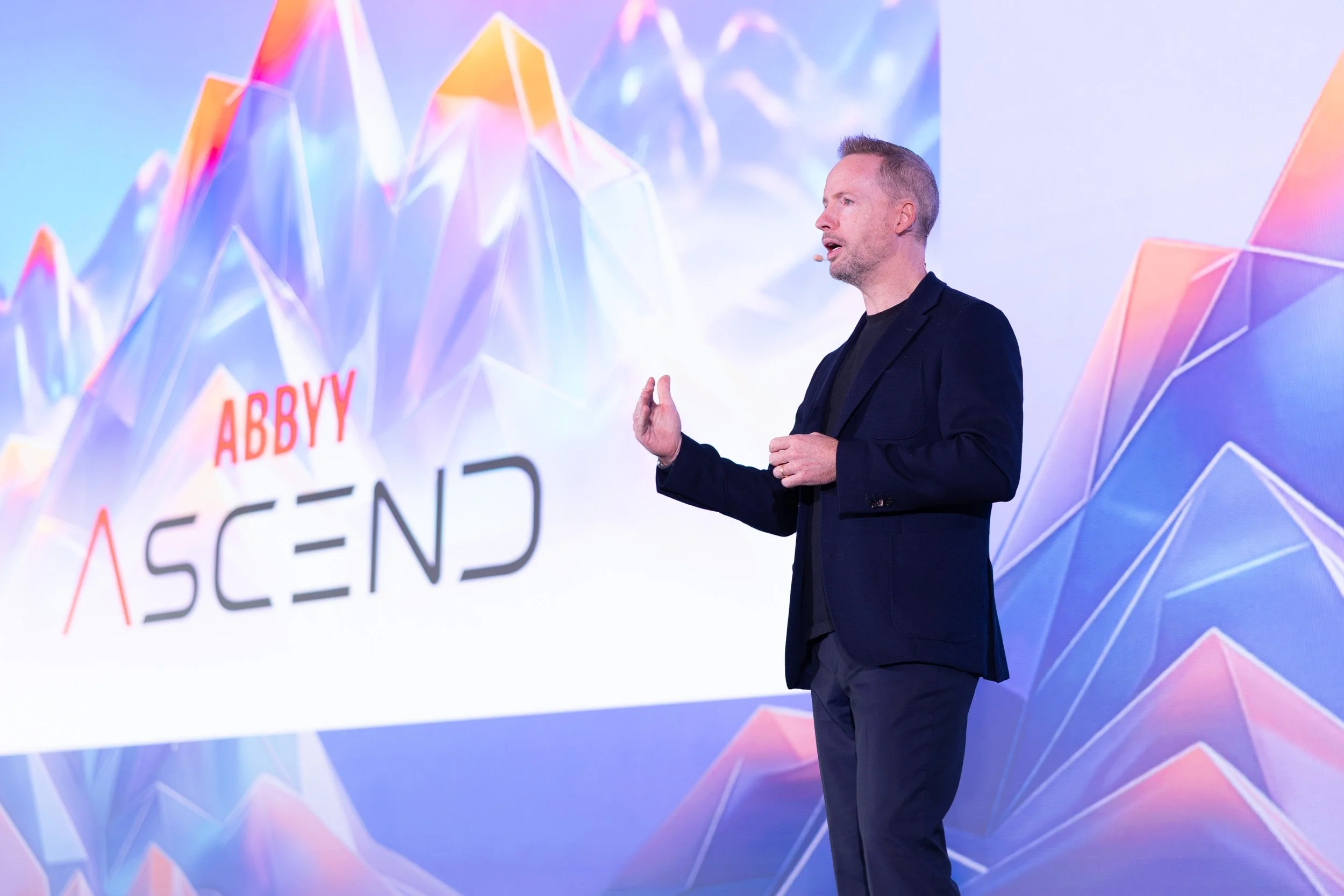  Keynote speaker Neil Murphy presenting on stage at the ABBYY tech seminar in Singapore. 