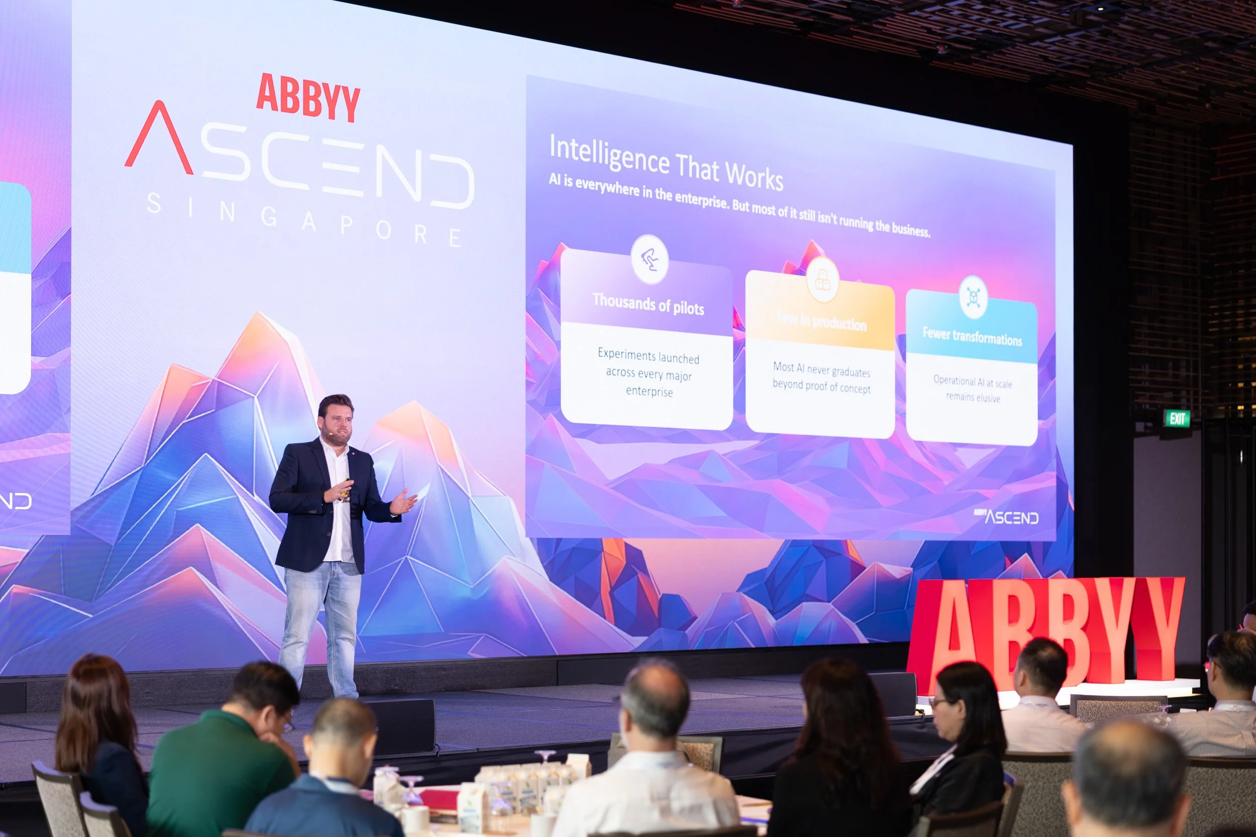  Wide stage view of speaker Maxime Vermeir presenting during the ABBYY corporate showcase. 
