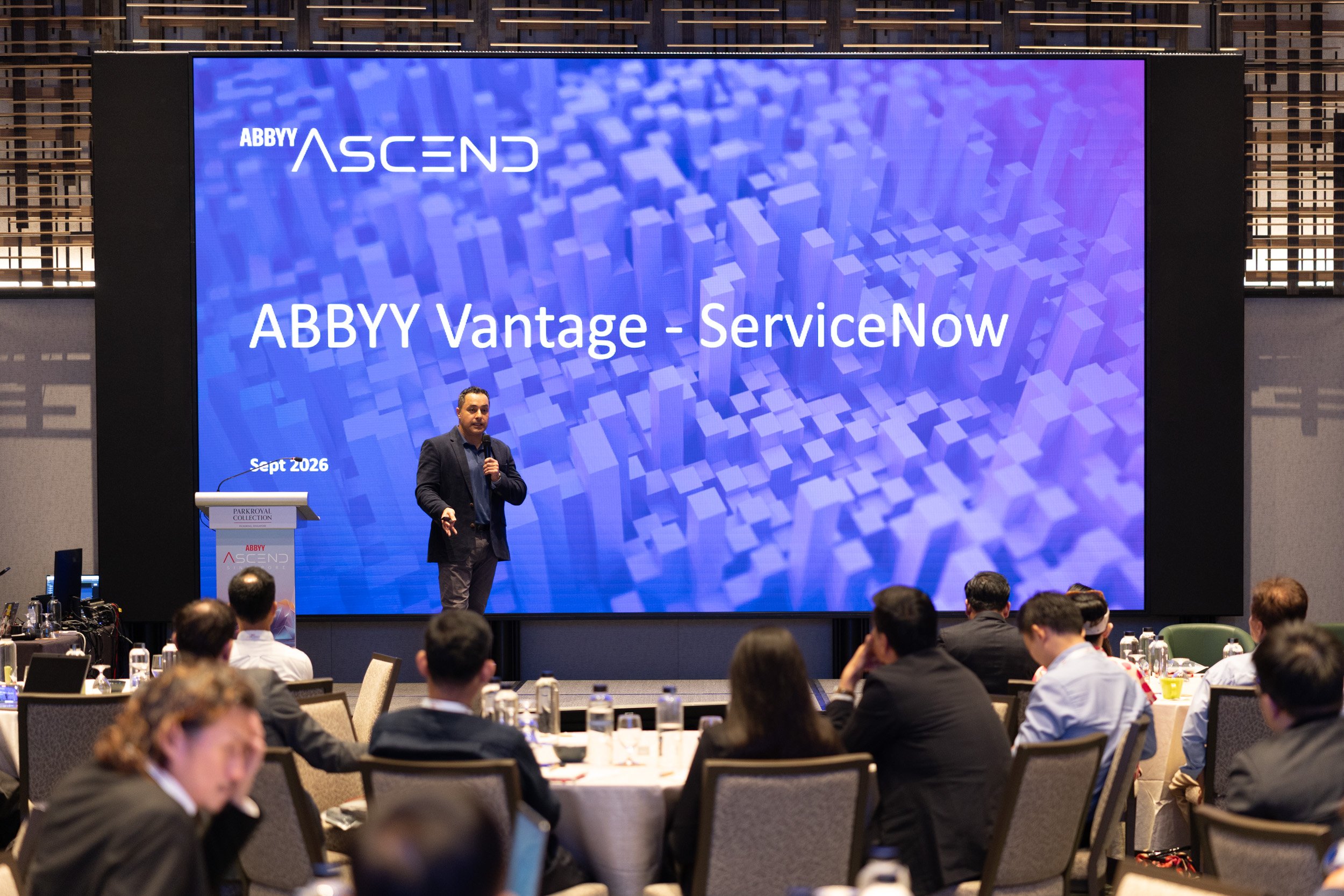  Wide view of speaker Marwan Farhat addressing the audience at the ABBYY enterprise technology seminar. 