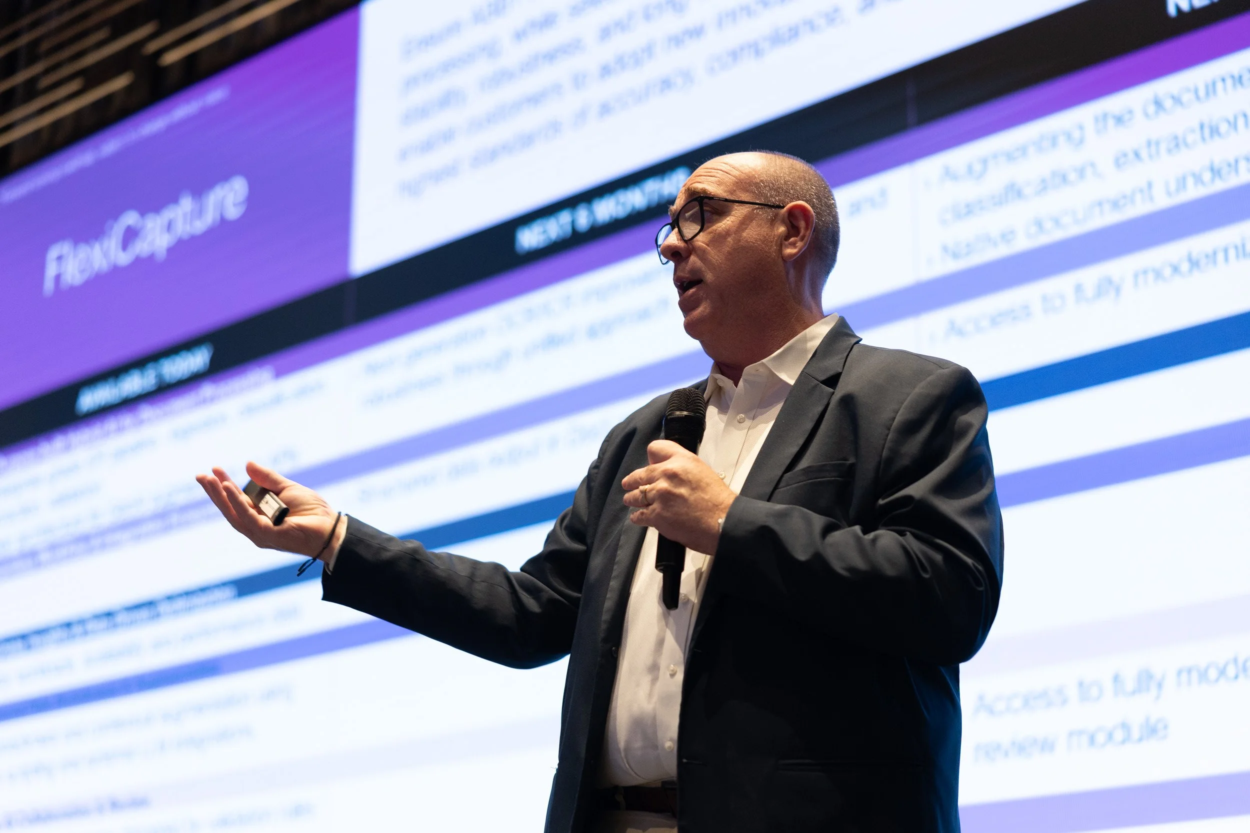  Keynote speaker Bruce Orcutt presenting on stage at the ABBYY Singapore corporate event. 