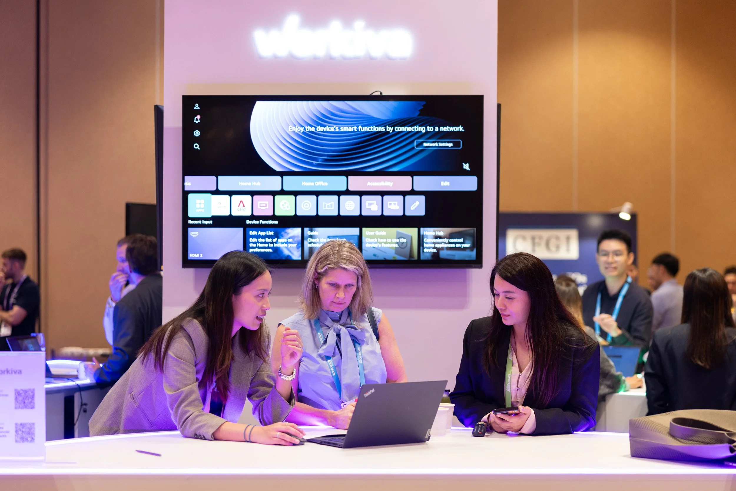  Workiva team members chatting with two guests during a networking break. 
