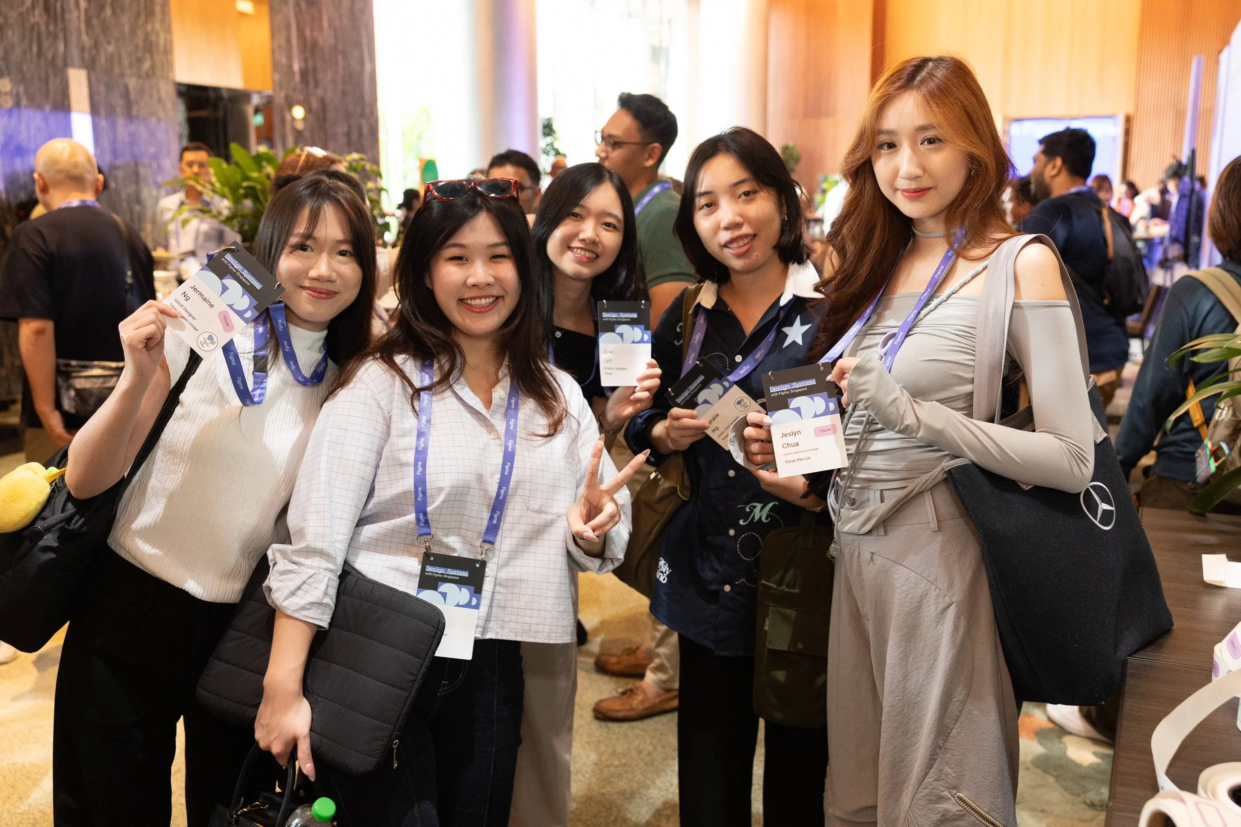  Posed group portrait of five corporate guests attending Design Systems with Figma Singapore. 