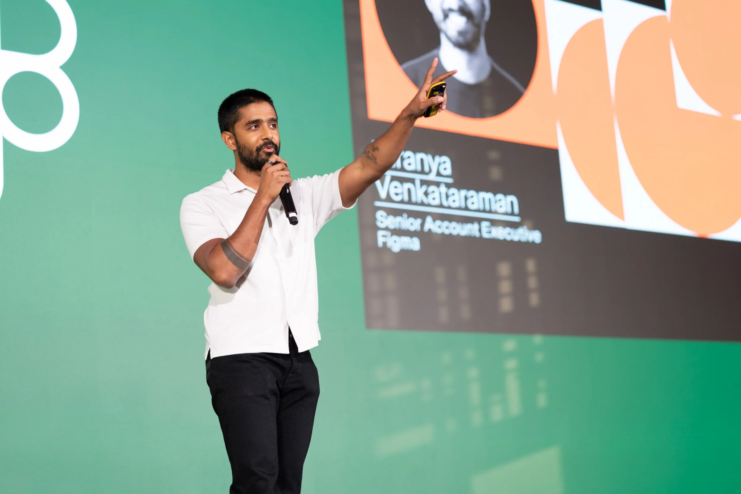  Close up view of keynote speaker Hiranya Venkataraman presenting on stage. 