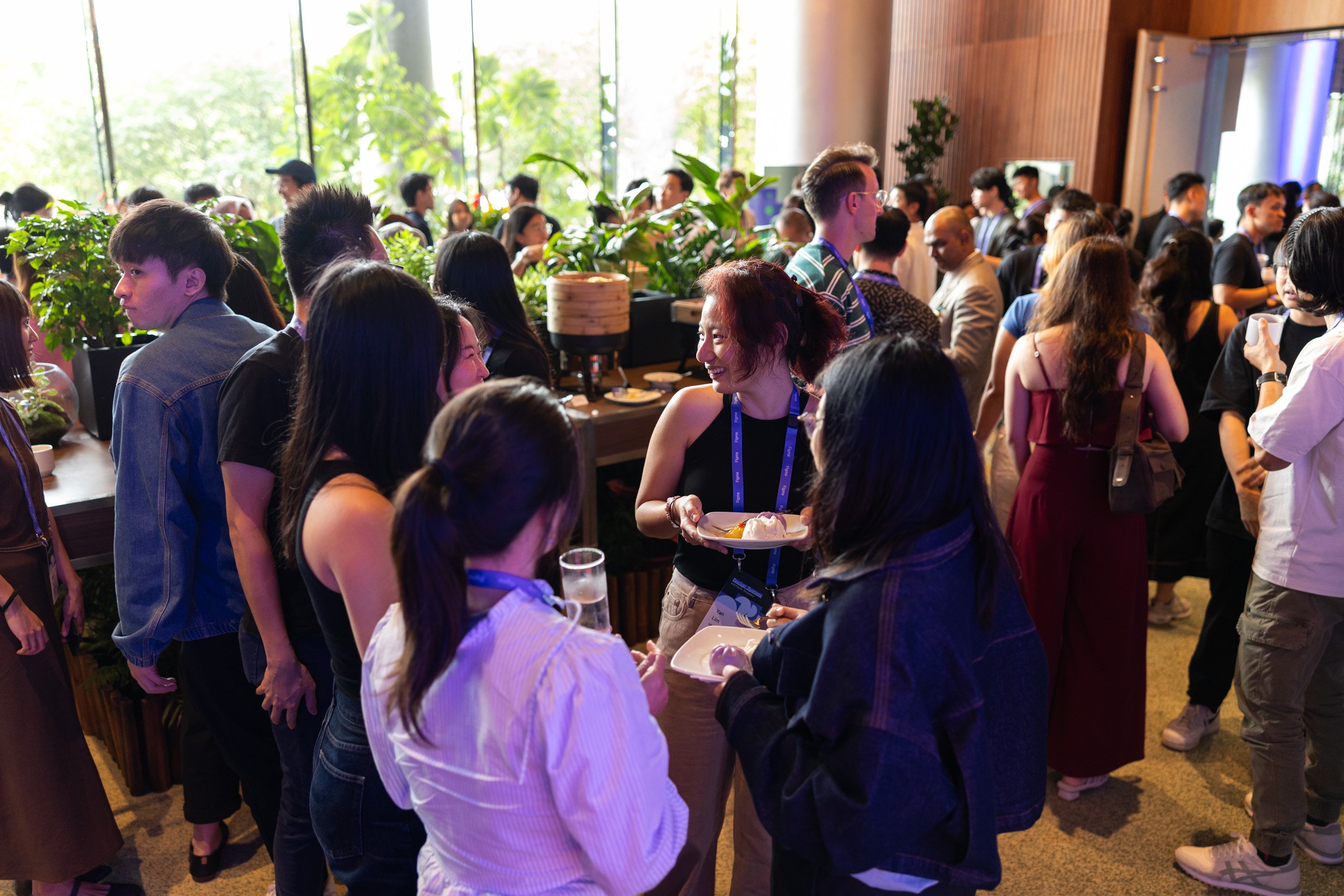  Wide angle view of corporate guests networking in the ballroom foyer. 