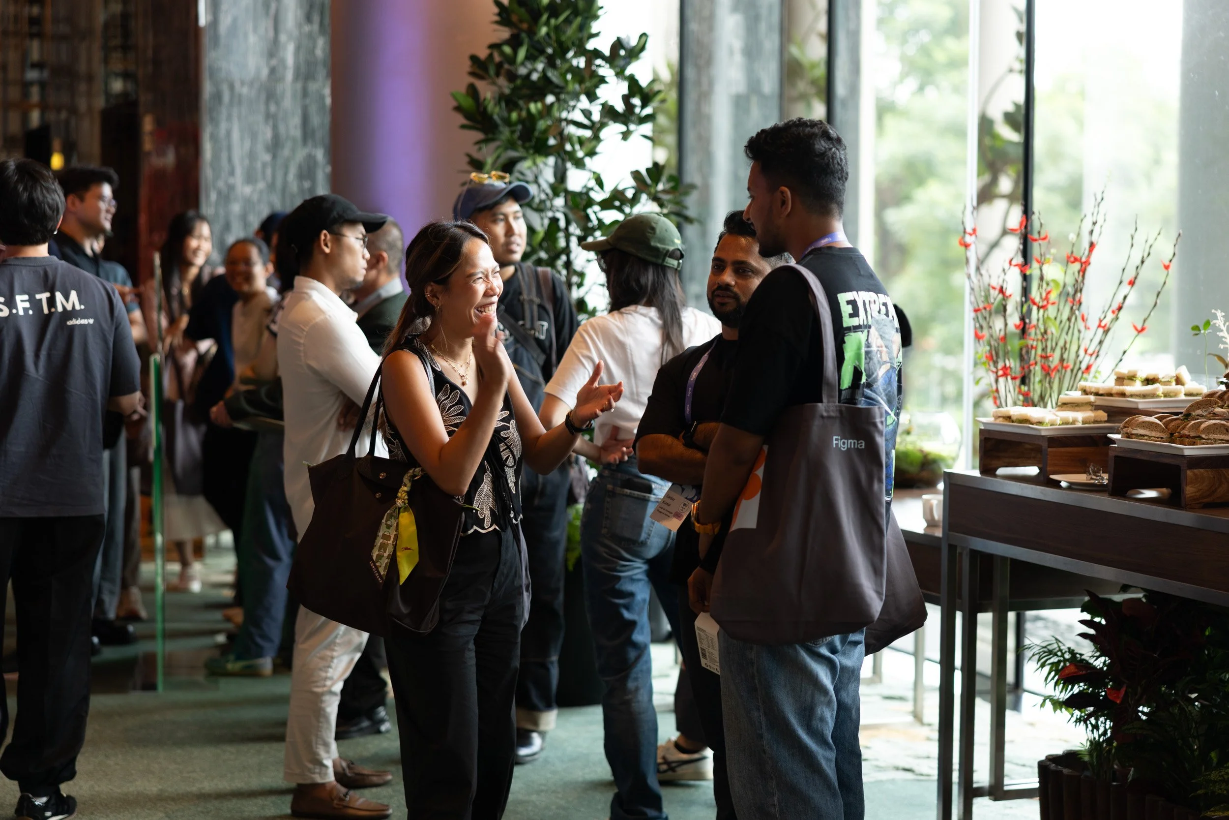  Conference attendees engaged in discussion during a networking session at PARKROYAL Pickering. 