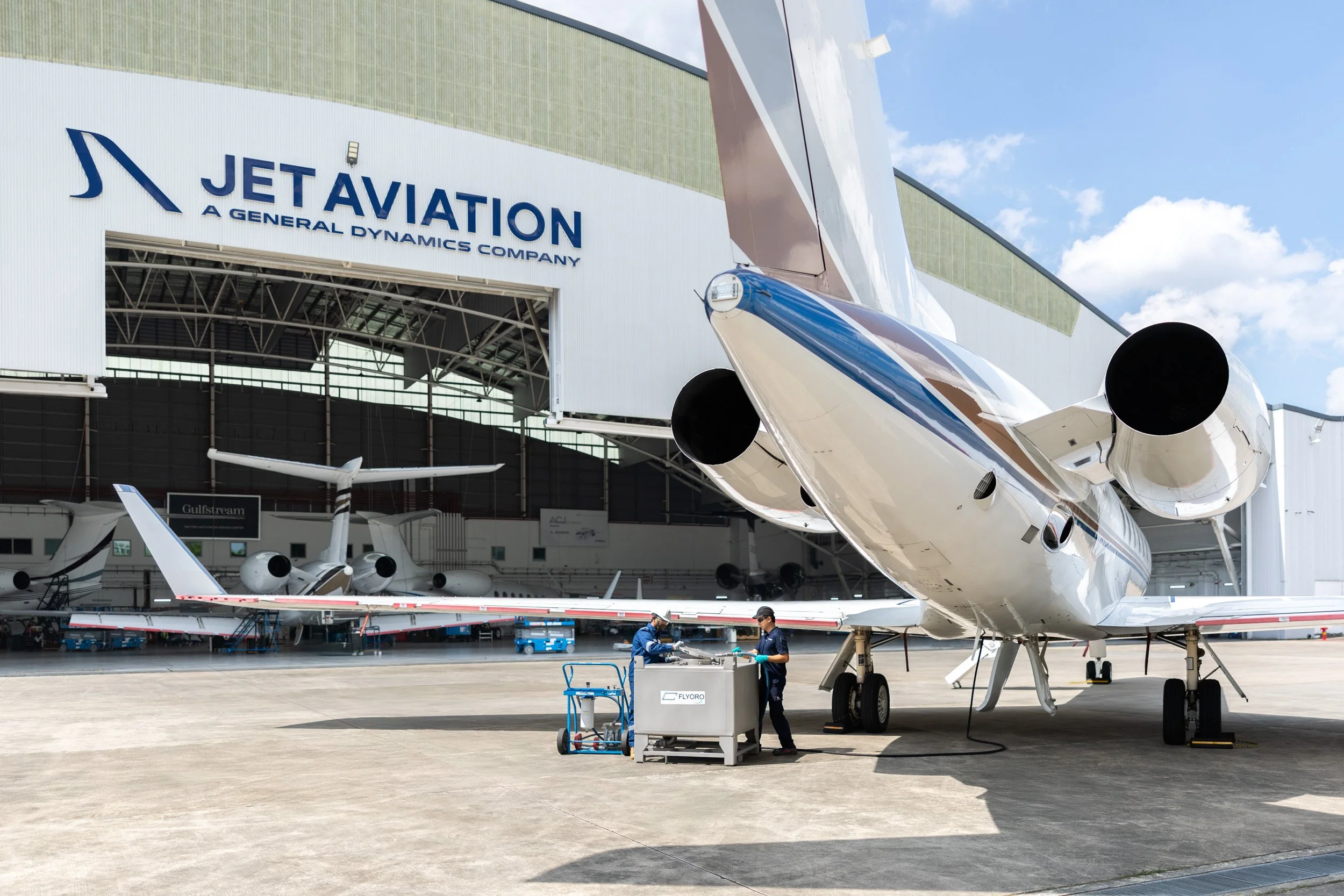  Exterior rear view of private aircraft tail fin parked outside the Jet Aviation maintenance facility. 