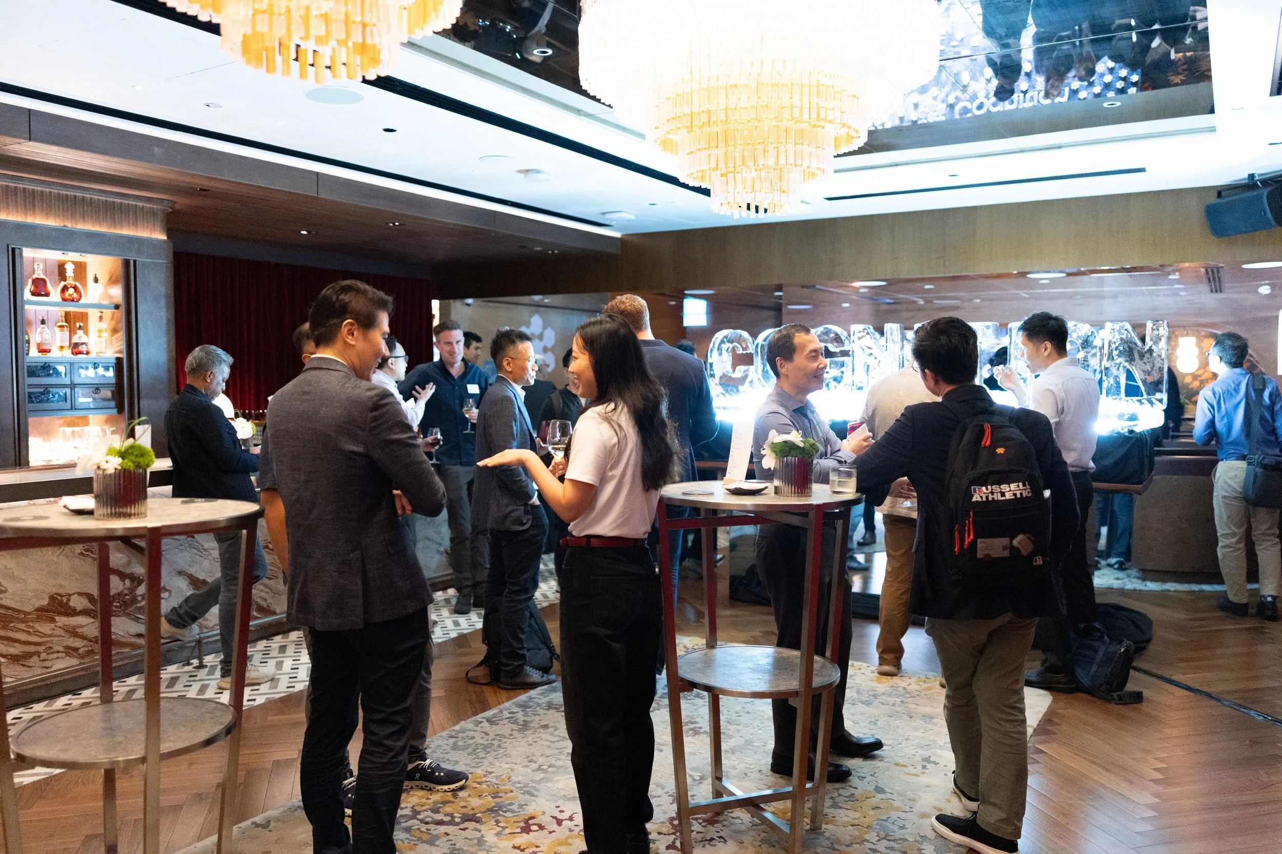  Guests networking and socializing during the Cognition VIP reception at Fairmont Singapore. 