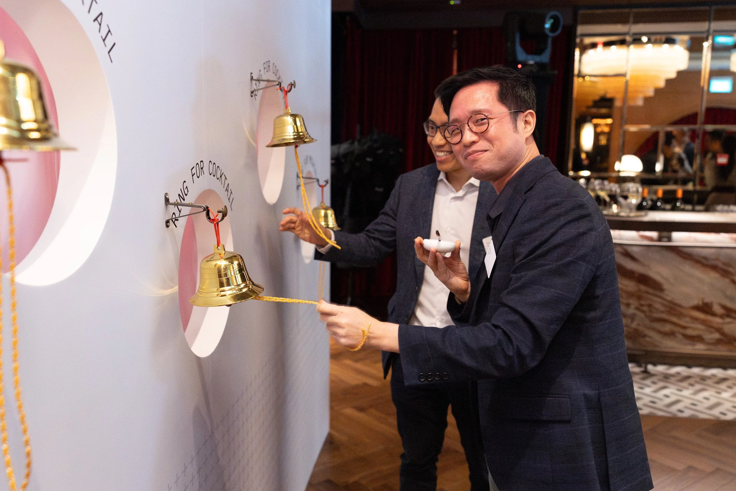  Interactive cocktail wall experience where guests ring a bell to receive drinks at Anti:Dote. 