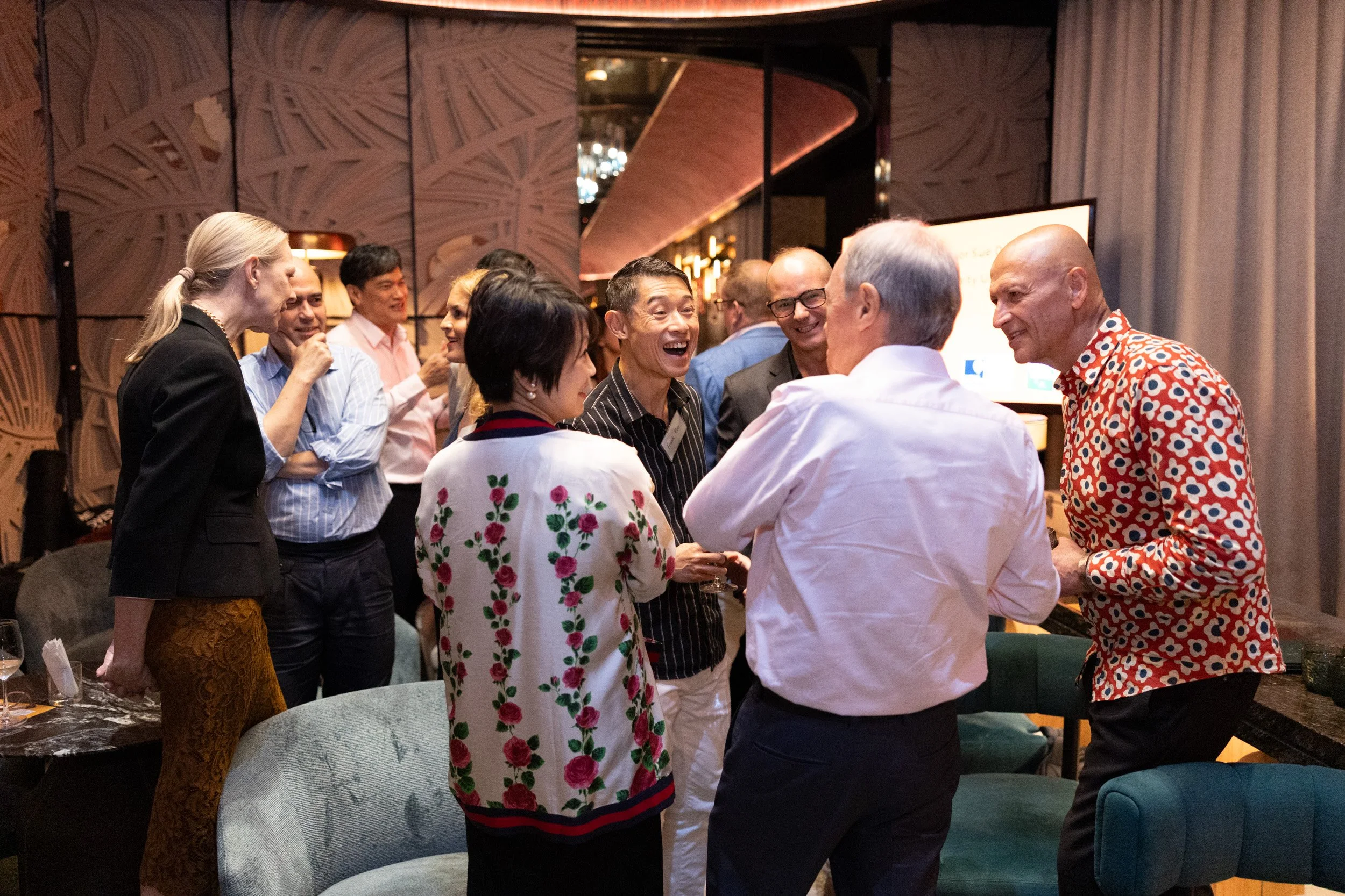  Candid event photography of guests networking during The Change Leaders book relaunch reception. 