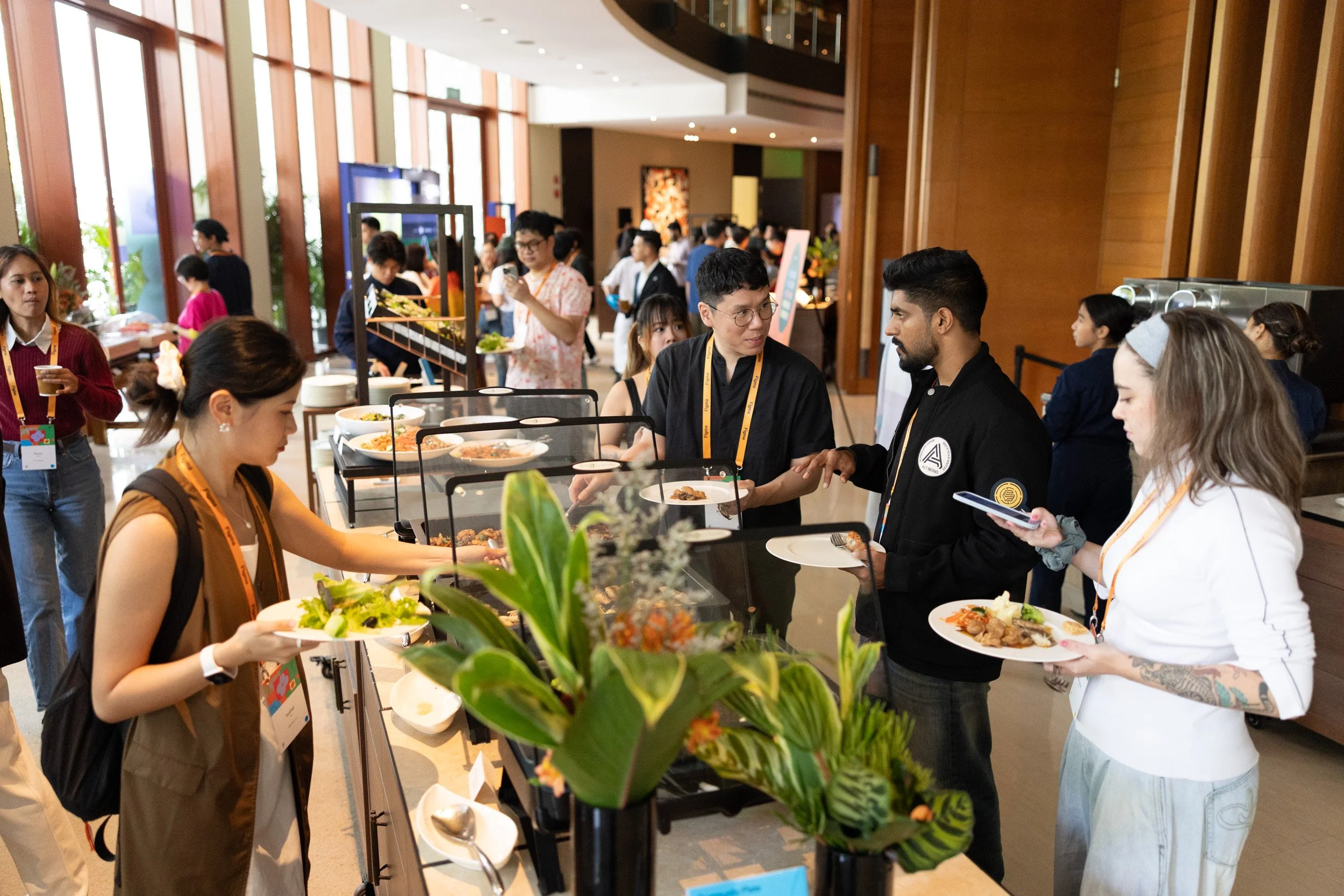  Guests serving themselves from the catered gourmet food station during the Maker Collective reception. 