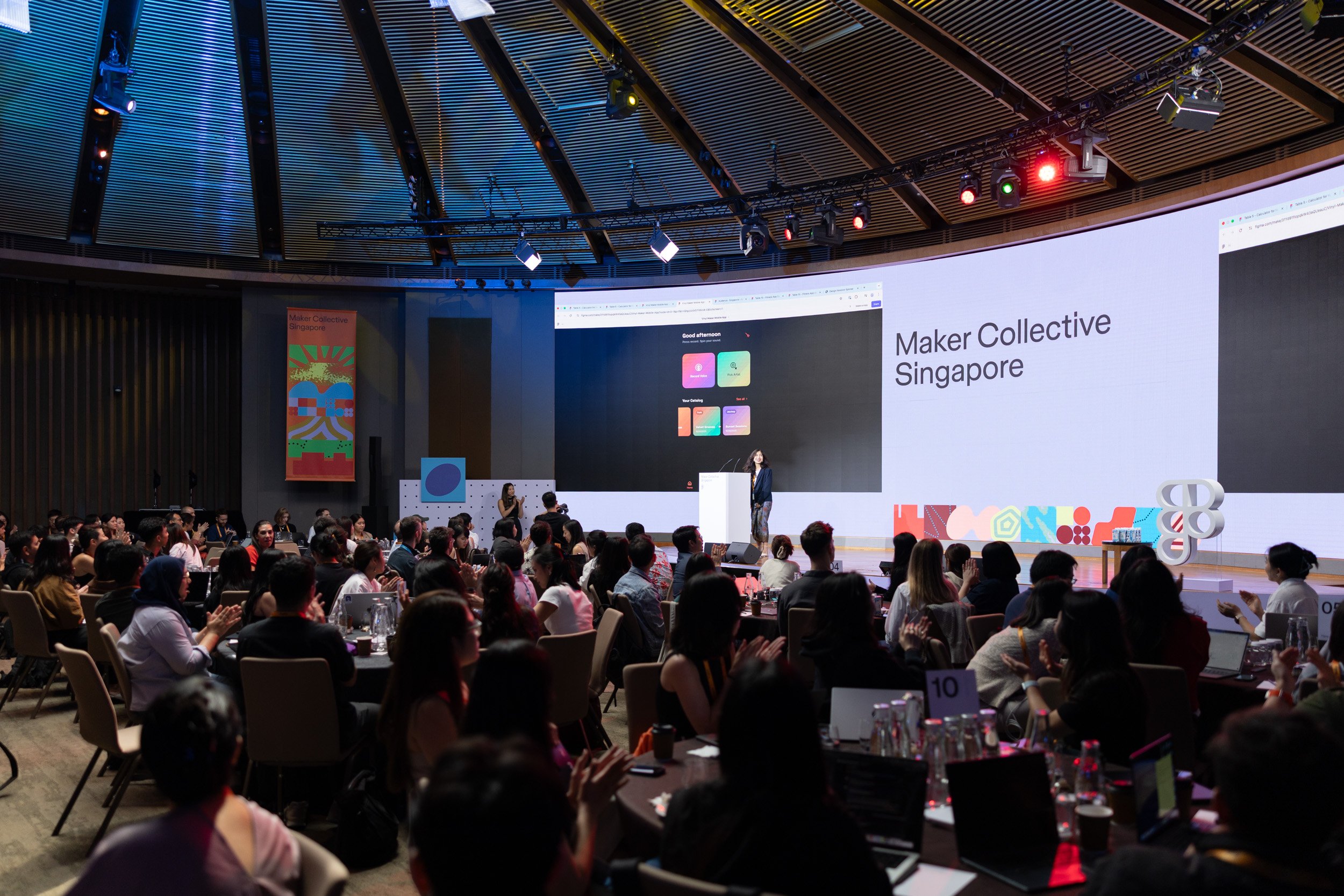  Event attendee presenting custom design work created in Figma during the community showcase. 