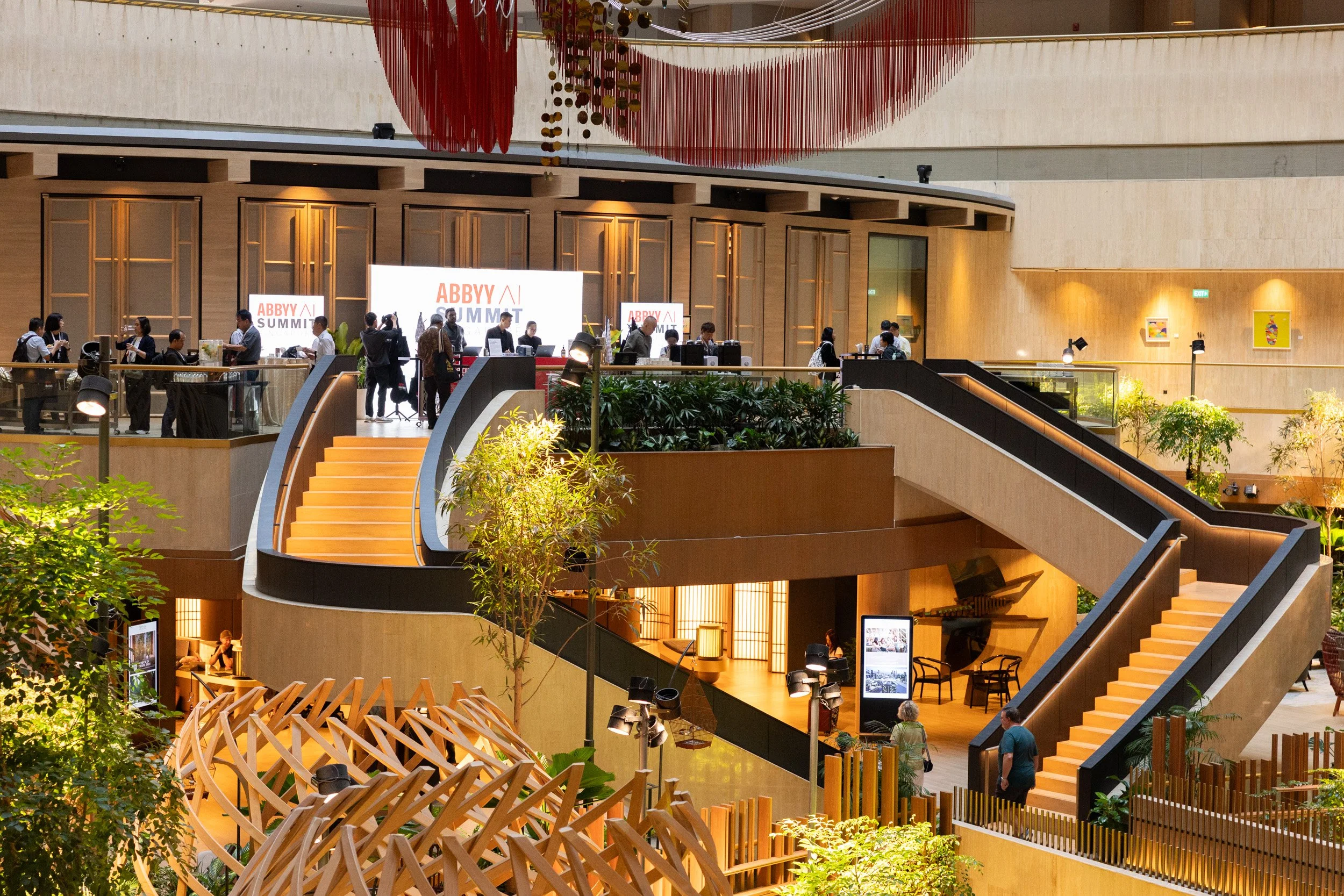  Wide angle interior view of the grand staircase and indoor greenery outside the function rooms at PARKROYAL COLLECTION Marina Bay. 