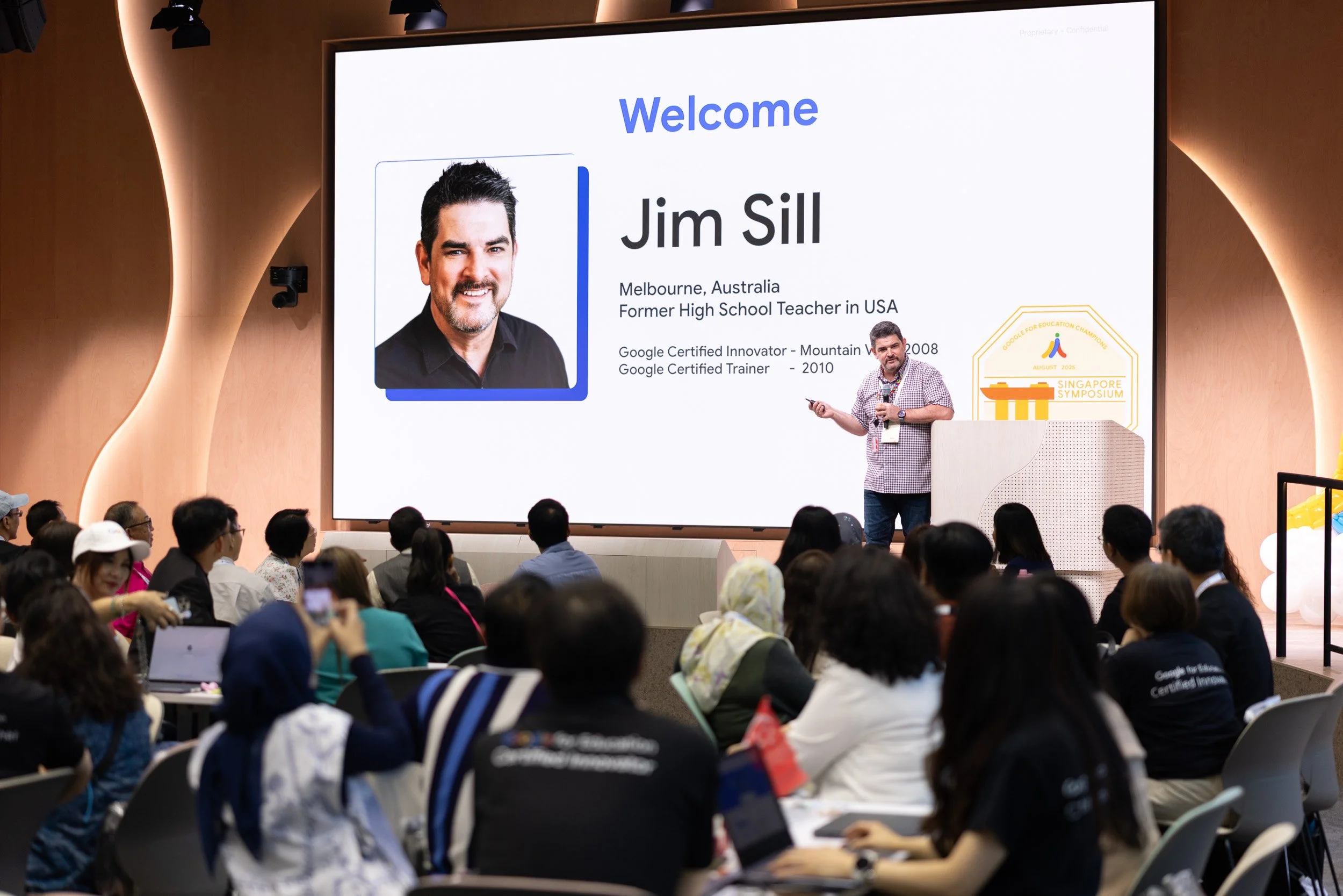  Medium shot of presenter Jim Sill addressing educators and delegates at Google Singapore. 