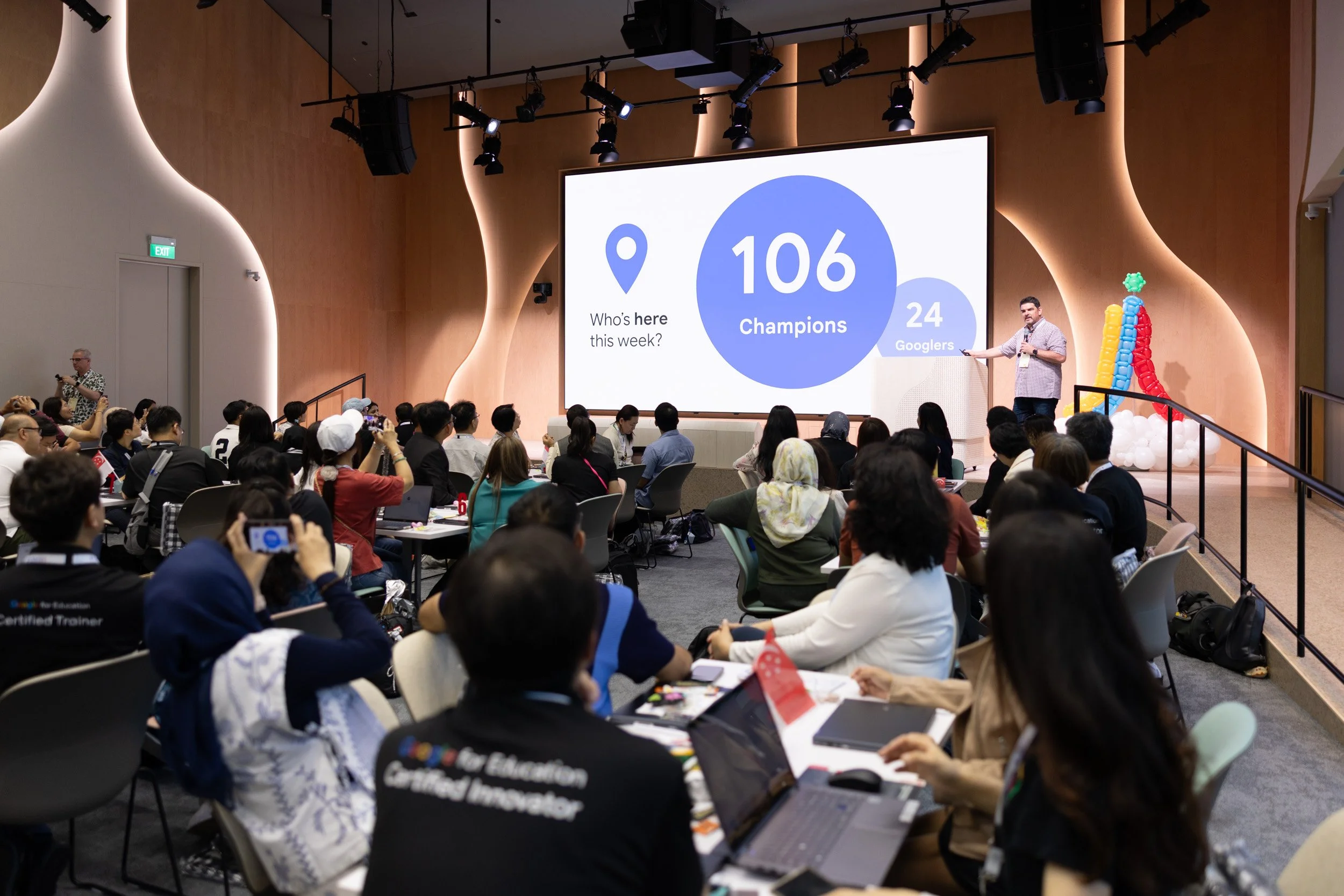  Wide angle perspective of Jim Sill speaking during a plenary session at the Singapore Symposium. 