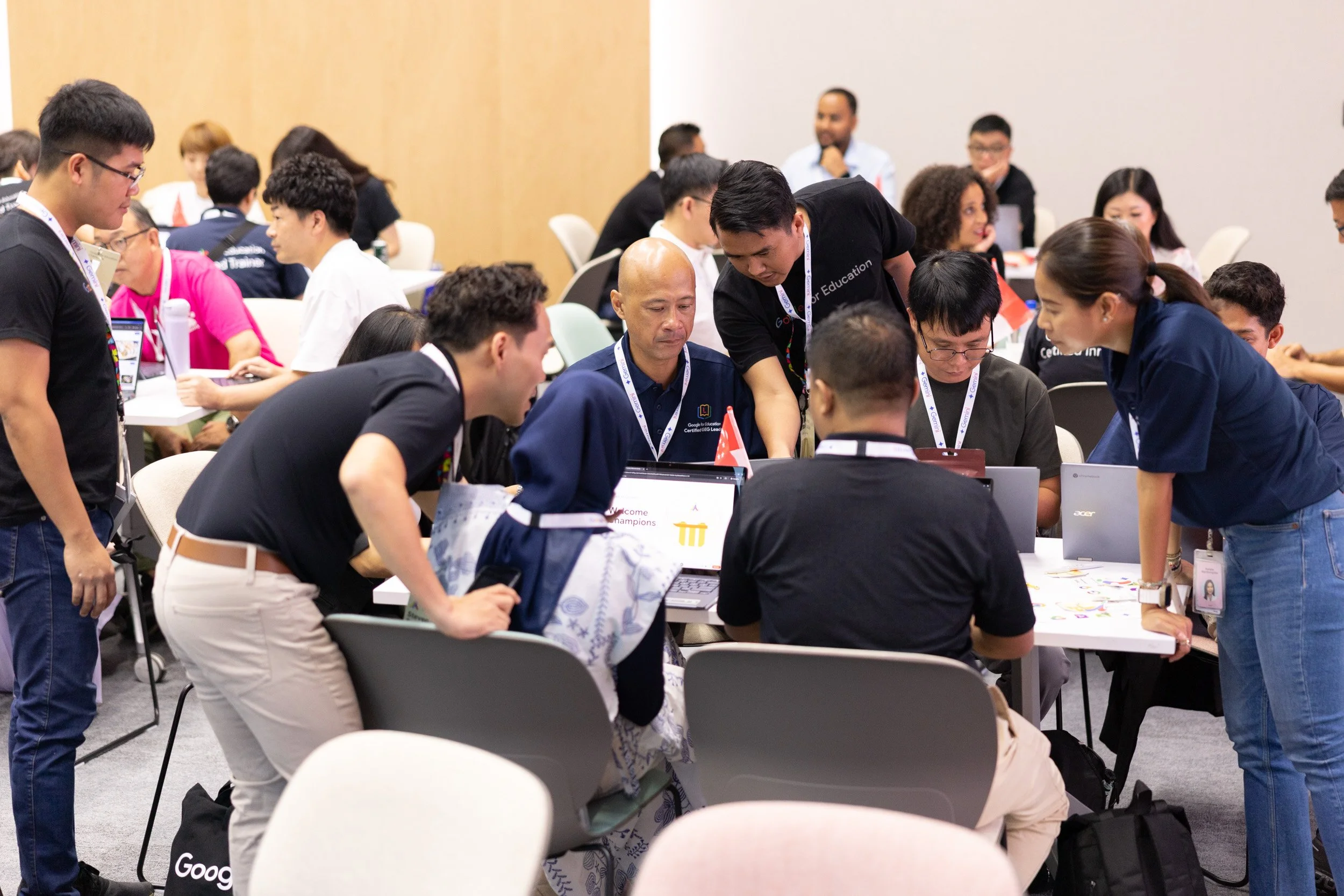  Candid event photography of educators engaged in group discussions during an interactive workshop. 