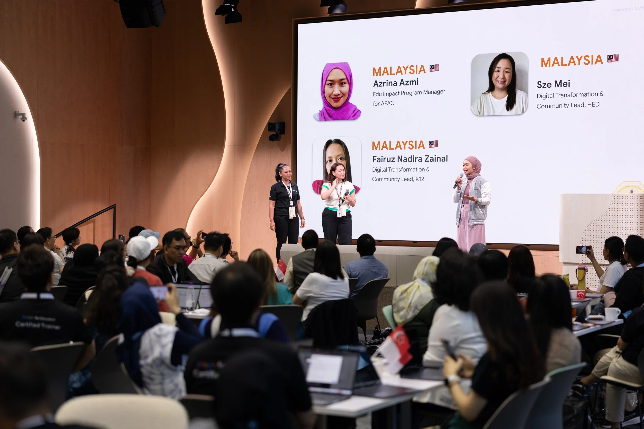  Medium panel shot of Azina Azmi, Sze Mei, and Fairuz Nadira Zainal presenting together on stage. 