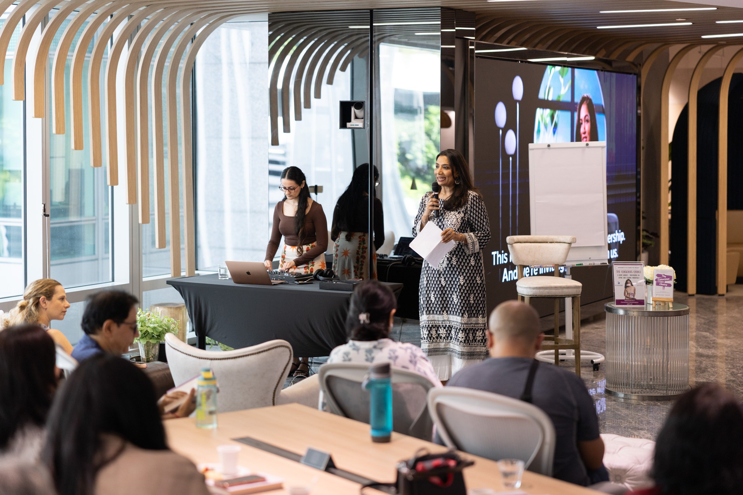  Binu Balan from B.Connected delivering opening remarks to attendees at the book launch event. 