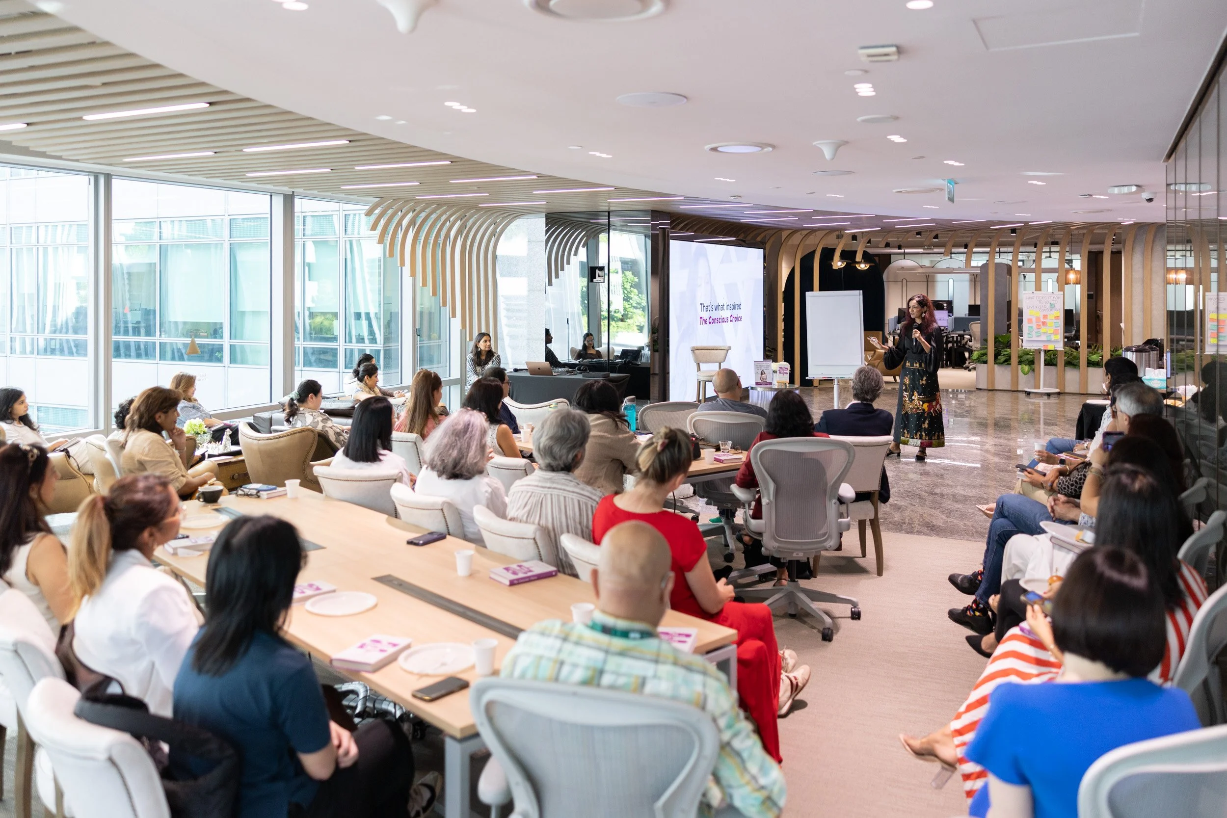  Wide angle presentation shot of author Bhavna Toor speaking to the audience. 