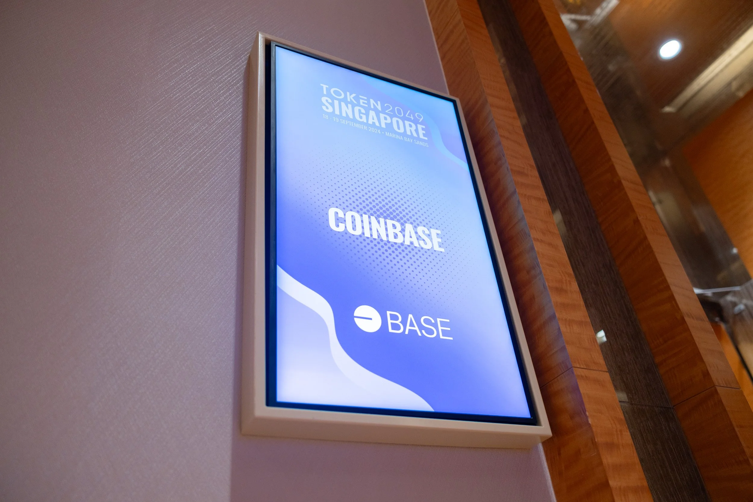  Digital screen displaying the official Token 2049 Singapore event title at Sands Expo &amp; Convention Centre. 