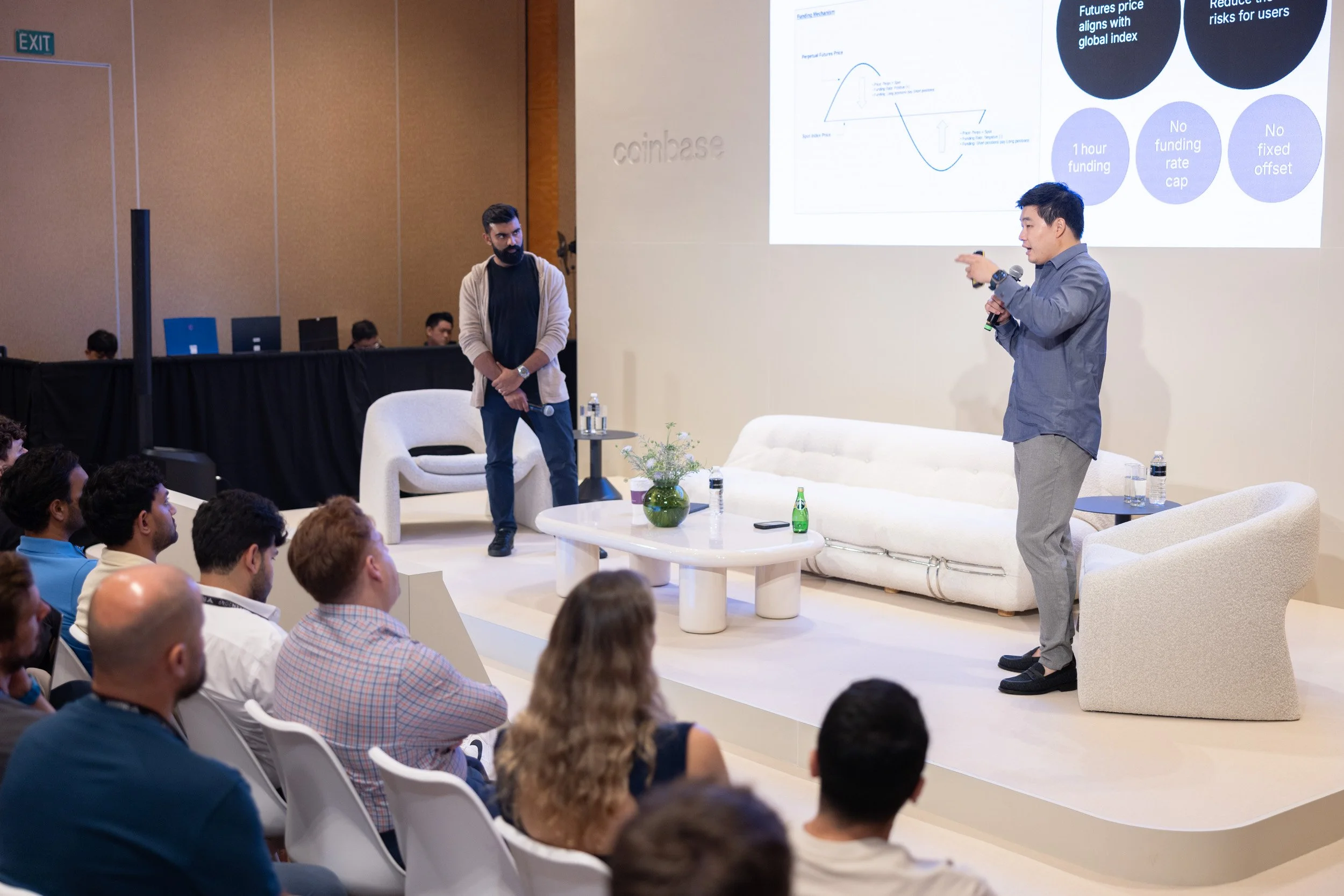  Wide angle stage photo capturing speakers leading an executive session at Token 2049. 